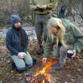 Our camp fire gets going as Annette inspects, Walk Like a Shadow: A Day With Ray Mears, Ashdown Forest, East Sussex - 29th December 2005
