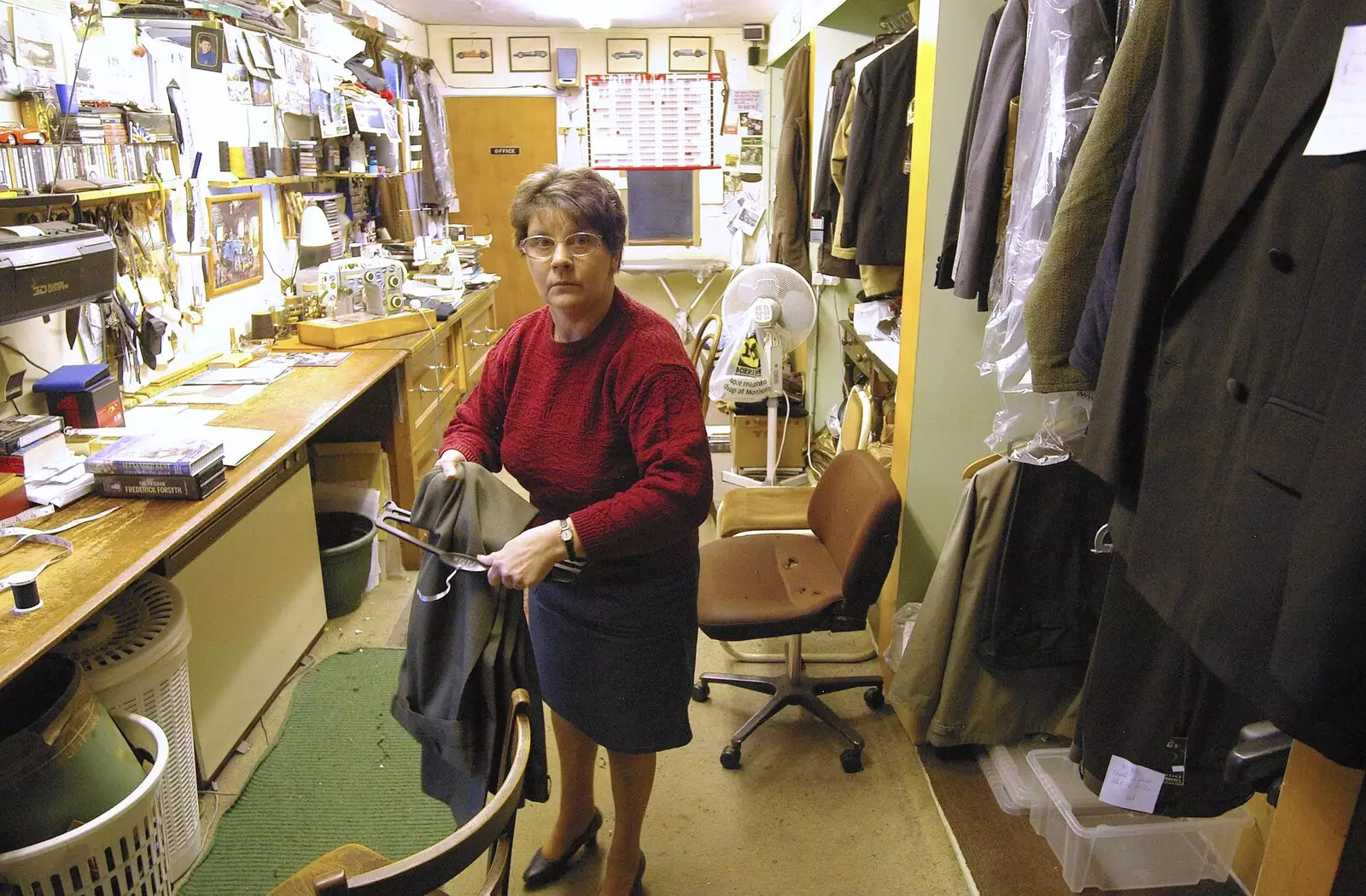 The repairer looks up, from A Portrait of Hopgoods: Gentlemen's Outfitters, Diss, Norfolk - 4th January 2006