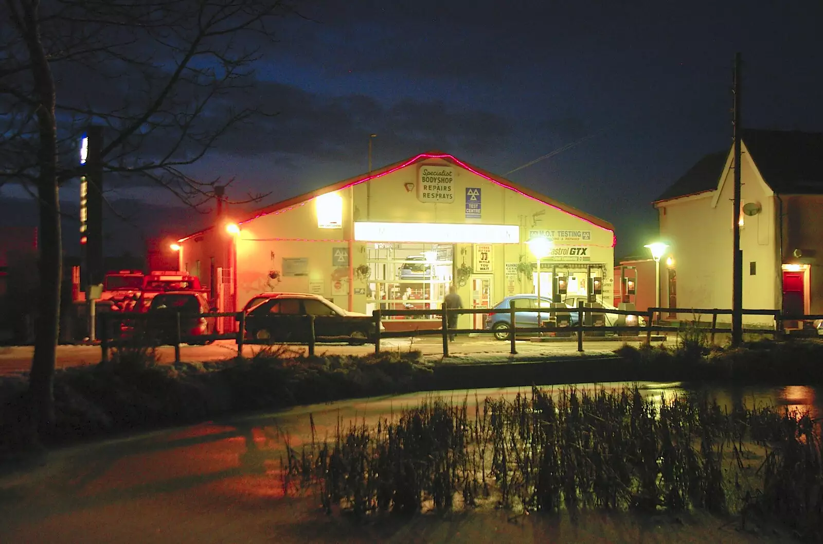 Lambert's Service Station over the village pond, from Dom in da Chapel, Safeway Chickens and Evil Supermarkets, Harleston and Grimston - 15th January 2006