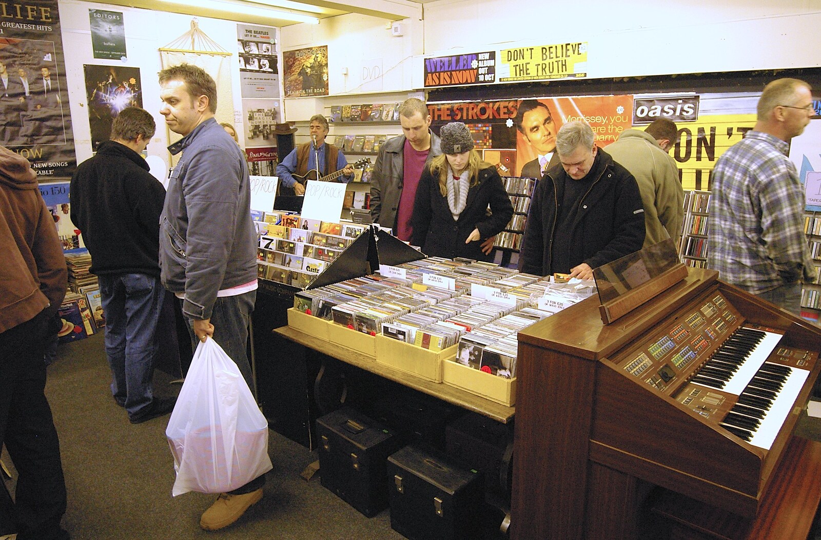 People mill around scavenging reduced stock from Closing Down: Viva La Revolution Records, Diss, Norfolk - 21st January 2006