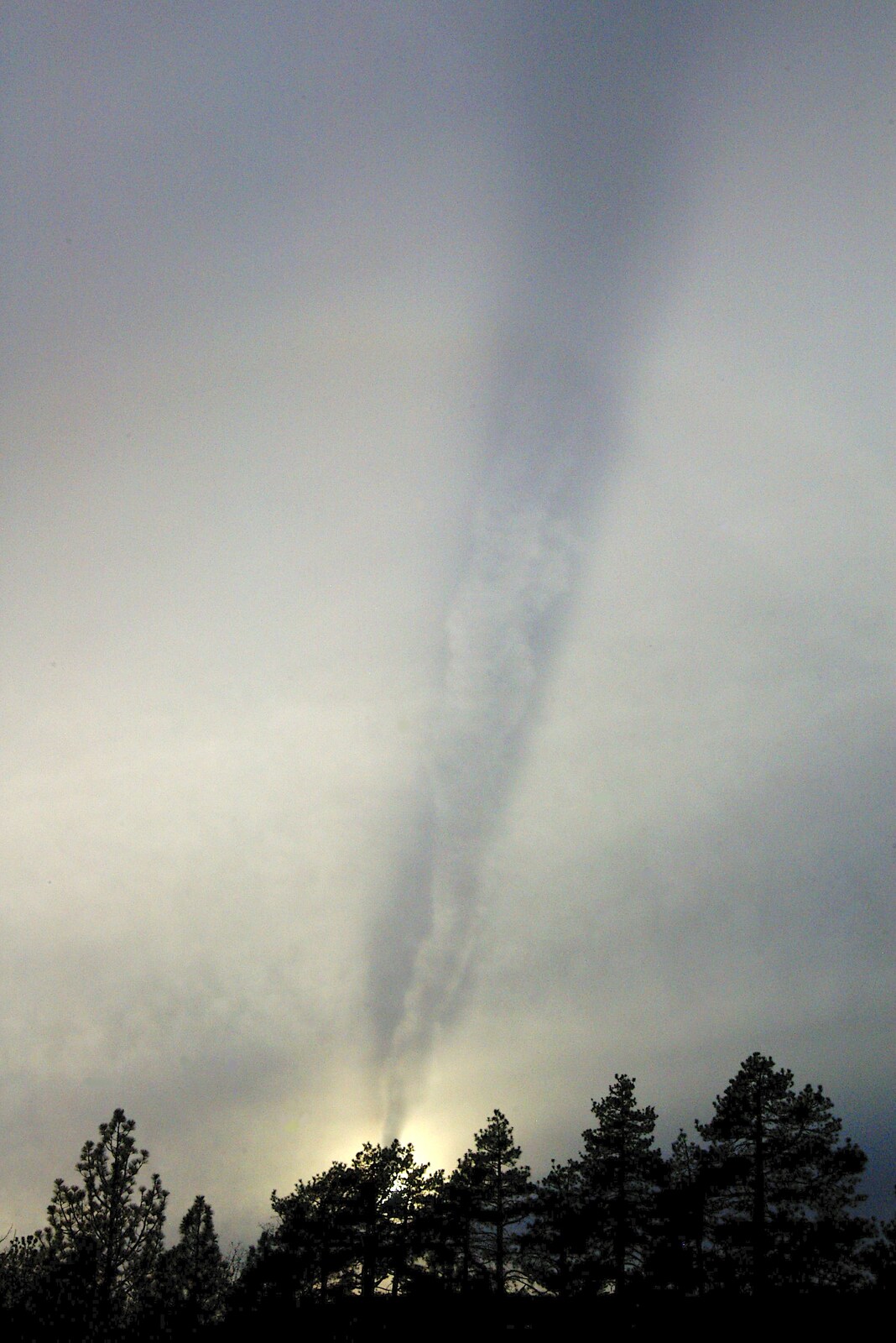 The shadow of a contrail on high cloud from California Snow: San Bernadino State Forest, California, US - 26th March 2006