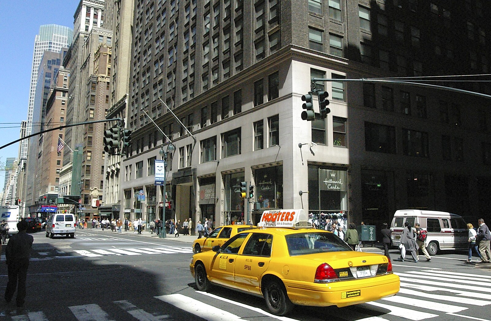 A taxi speeds past on 5th Avenue from Times Square, the Empire State and Ground Zero, New York, US - 1st May 2006
