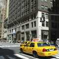 A taxi speeds past on 5th Avenue, Times Square, the Empire State and Ground Zero, New York, US - 1st May 2006