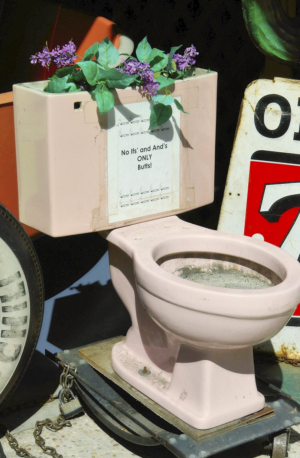 A porcelain toilet, used as a giant ash-tray from Times Square, the Empire State and Ground Zero, New York, US - 1st May 2006