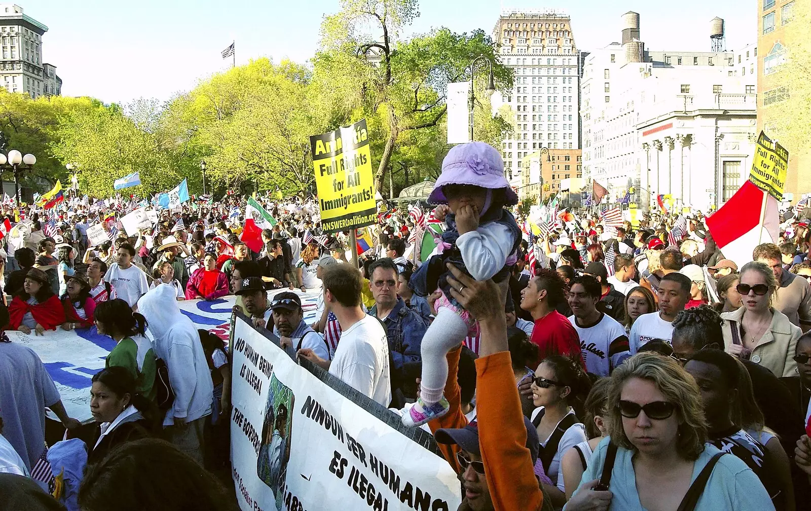 A baby is waved around, from A Union Square Demo, Bryant Park and Columbus Circle, New York, US - 2nd May 2006