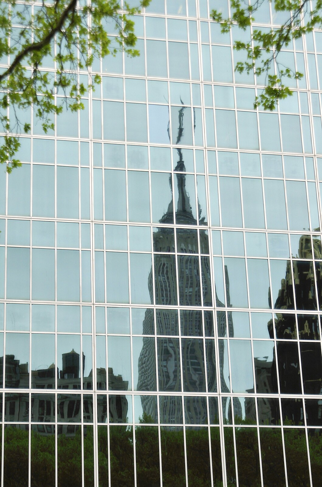 The Empire State Building reflected in glass from A Union Square Demo, Bryant Park and Columbus Circle, New York, US - 2nd May 2006