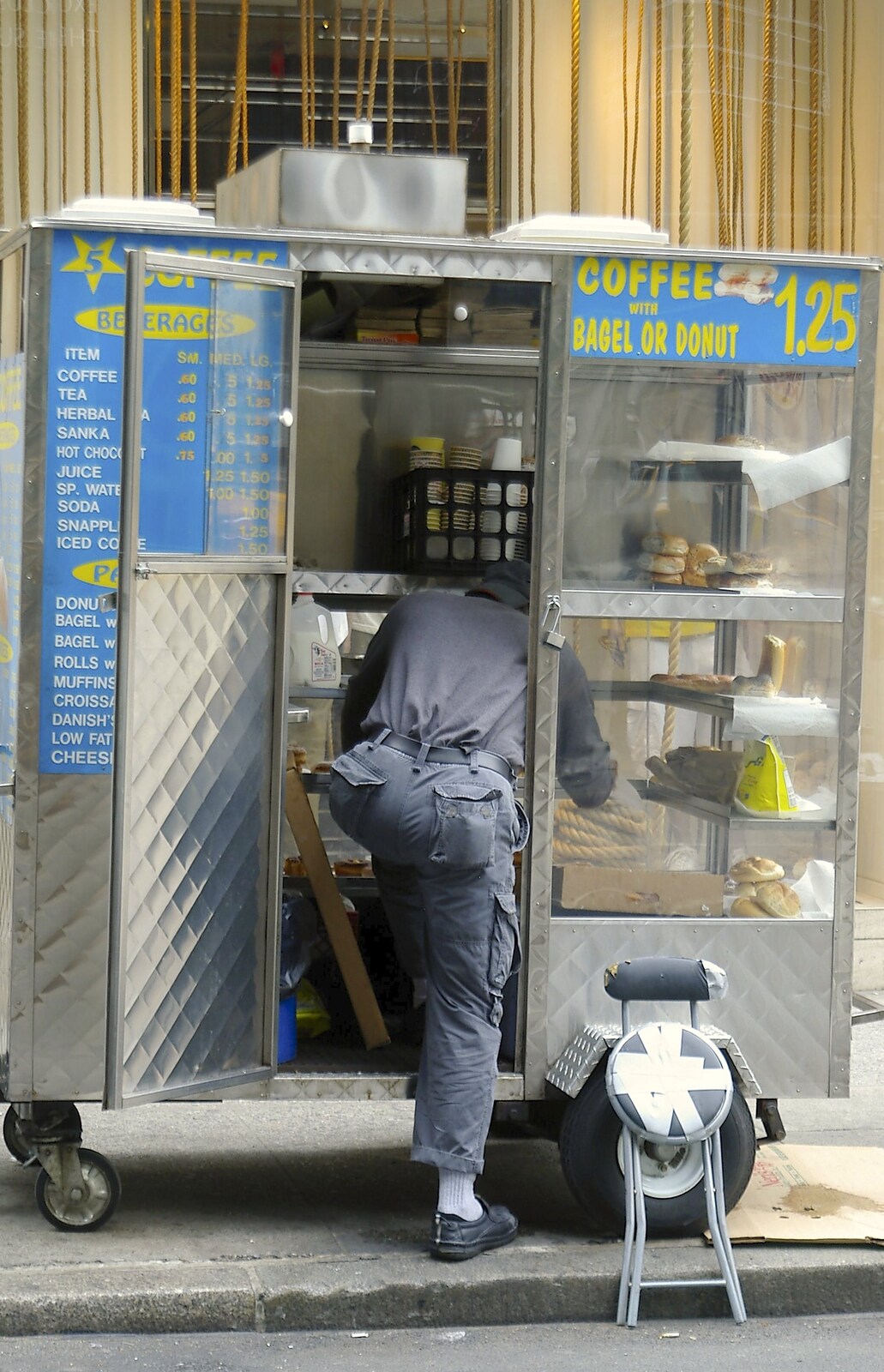 A guy escapes by climbing into his hot-dog van from A Union Square Demo, Bryant Park and Columbus Circle, New York, US - 2nd May 2006