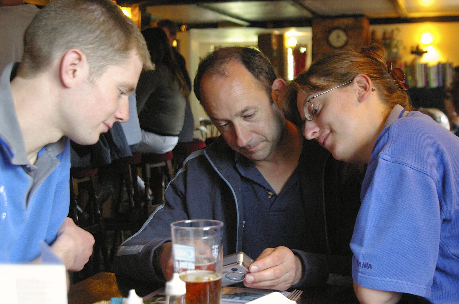 Phil, DH and Suey look at photos from The BSCC does The Pheasant Hotel, Kelling, Norfolk - 6th May 2006