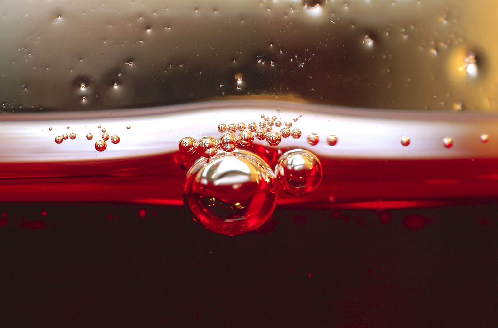 A collection of little bubbles in cranberry juice from Fun With Bellows: Macro Photography, Brome, Suffolk - 13th May 2006