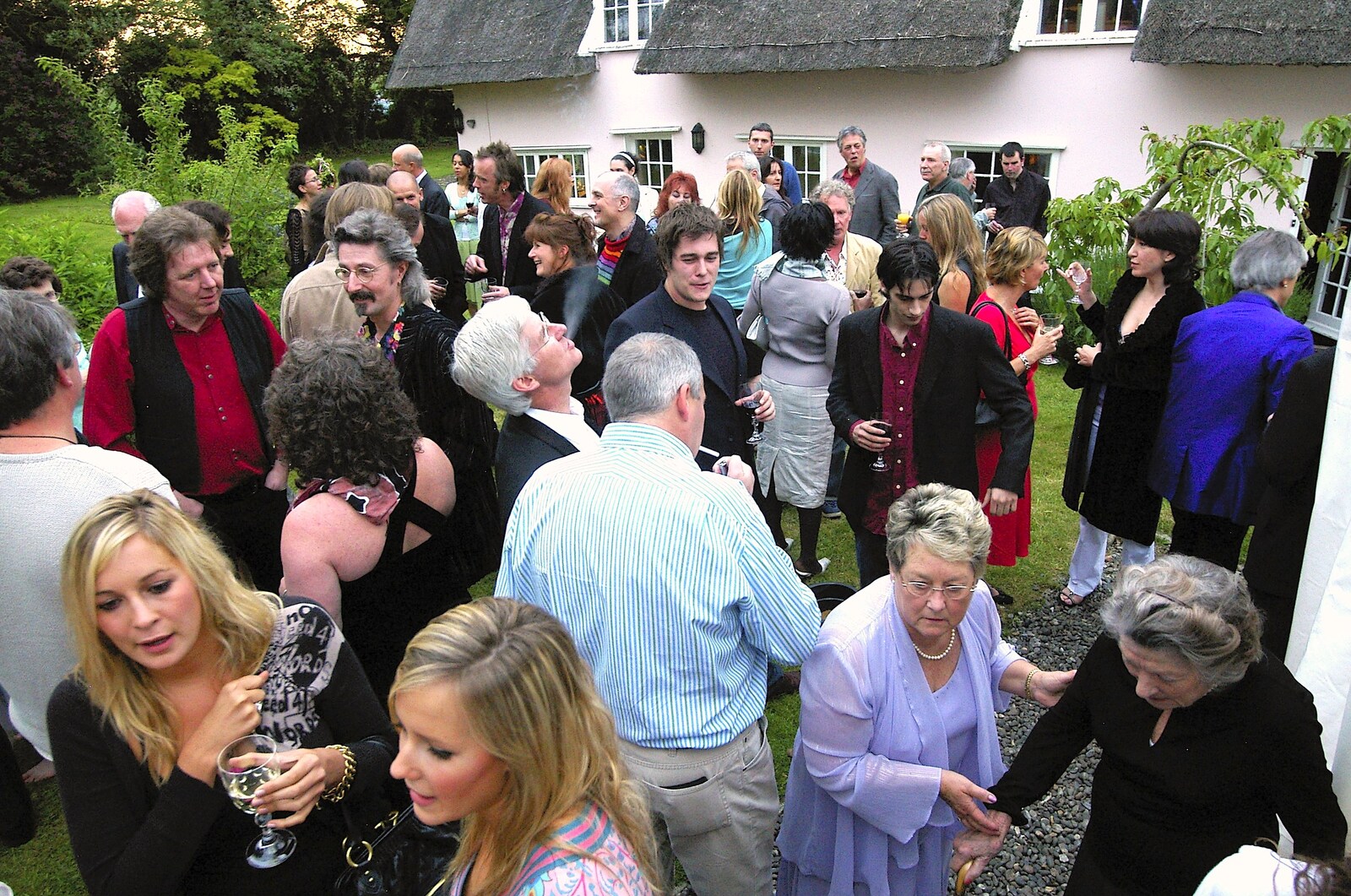 Guests in the garden from Henry and Fiona's Wedding Reception, Oakley, Suffolk - 2nd June 2006