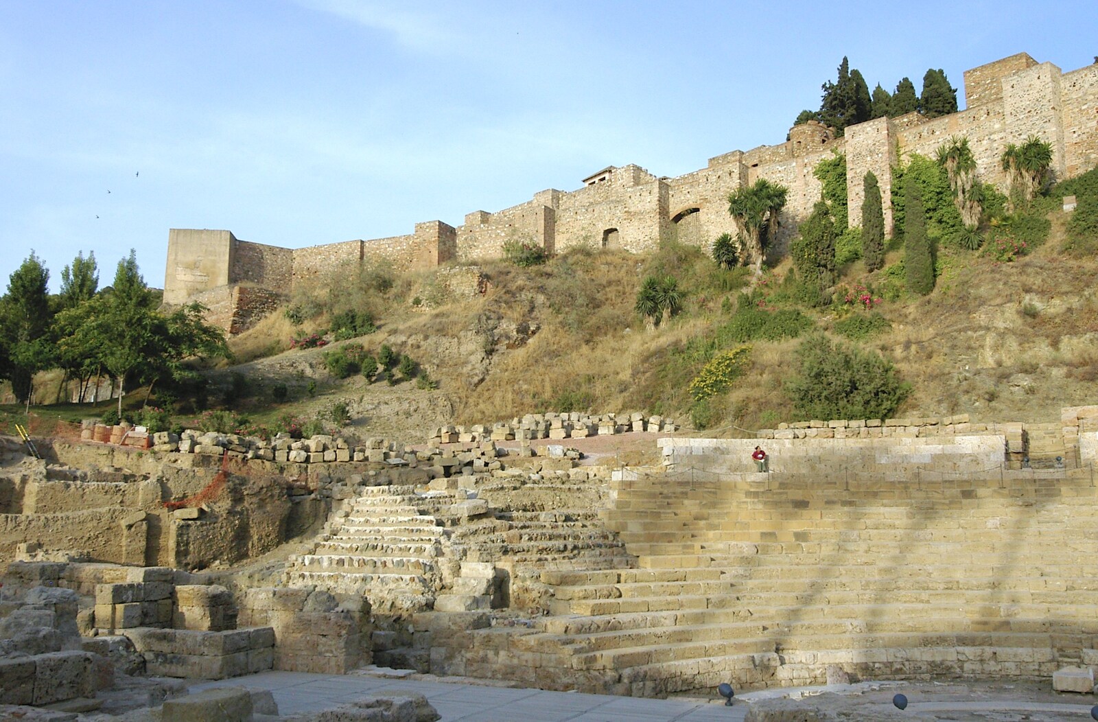 A solitary figure sits in the Roman ampitheatre from Working at Telefónica, Malaga, Spain - 6th June 2006