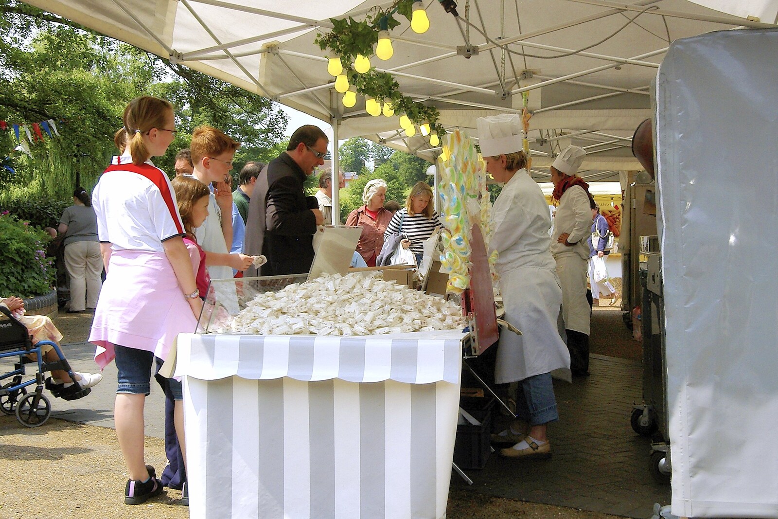 People throng a confectionery stall from A French Market Visits, Diss, Norfolk - 24th June 2006