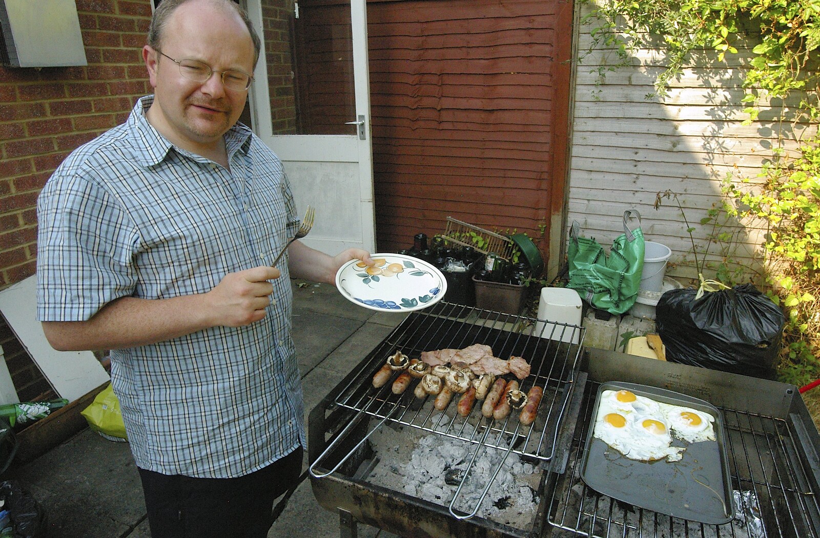 Hamish gets some barbeque offerings from Simon's Birthday Barbeque, Reading, Berkshire - 30th June 2006