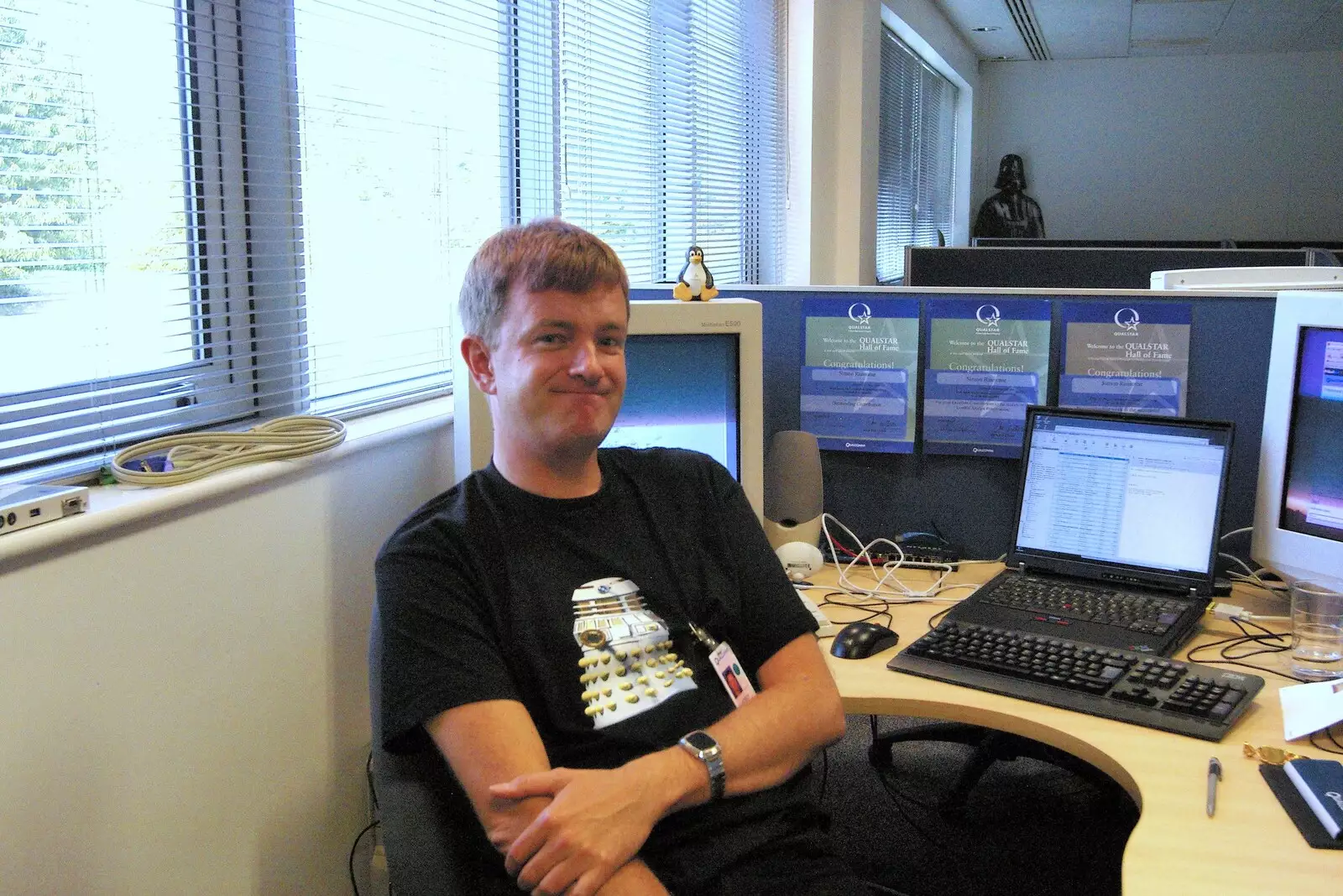 Nosher sits at the new desk, from Qualcomm's New Office Party, Science Park, Milton Road, Cambridge - 3rd July 2006