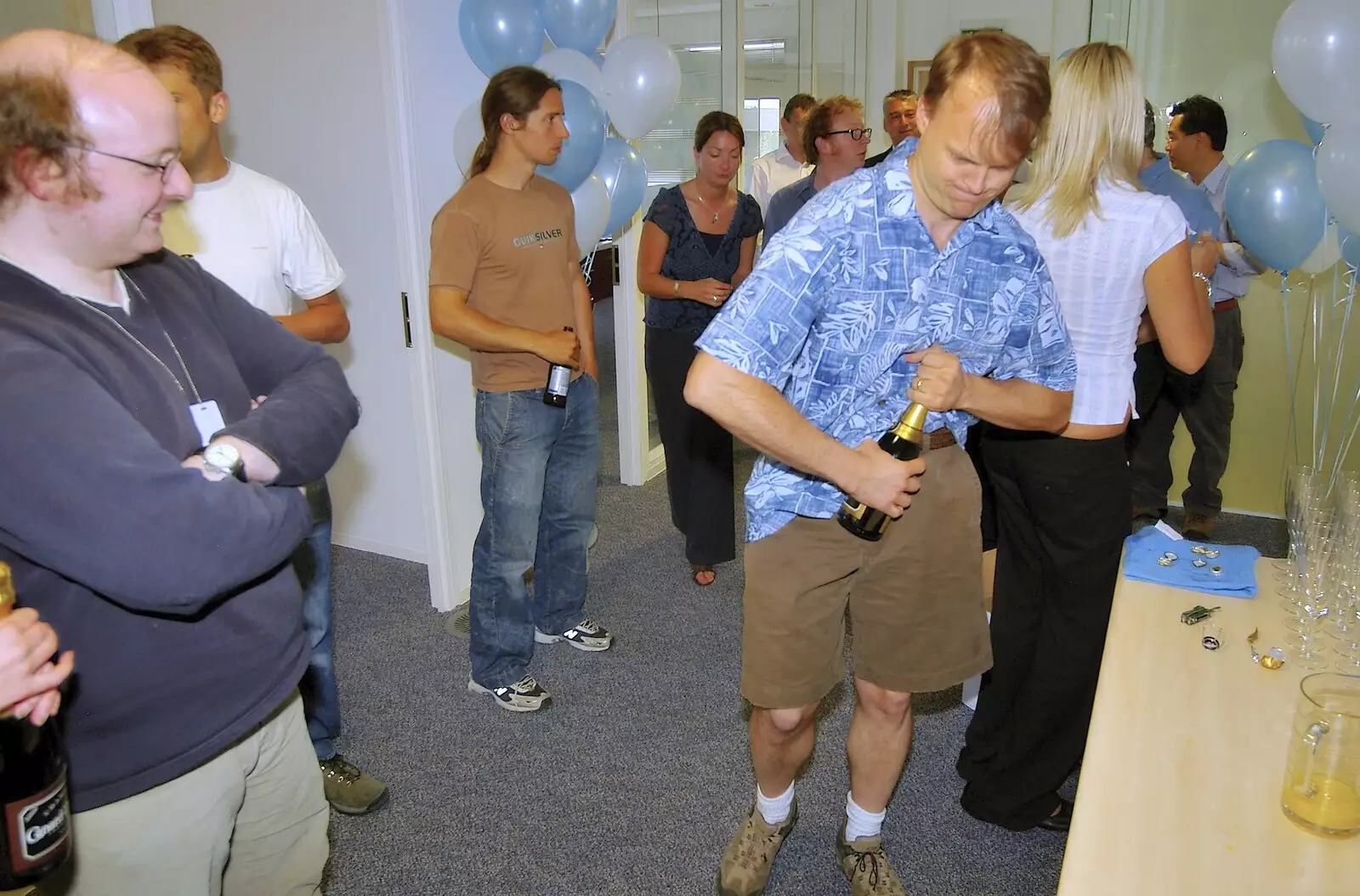 Nick helps out by opening Champagne, from Qualcomm's New Office Party, Science Park, Milton Road, Cambridge - 3rd July 2006