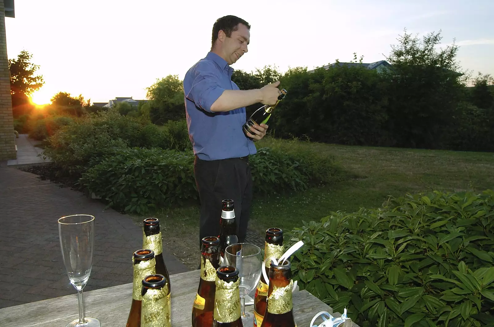 Leon reveals a secret stash of Champagne, from Qualcomm's New Office Party, Science Park, Milton Road, Cambridge - 3rd July 2006