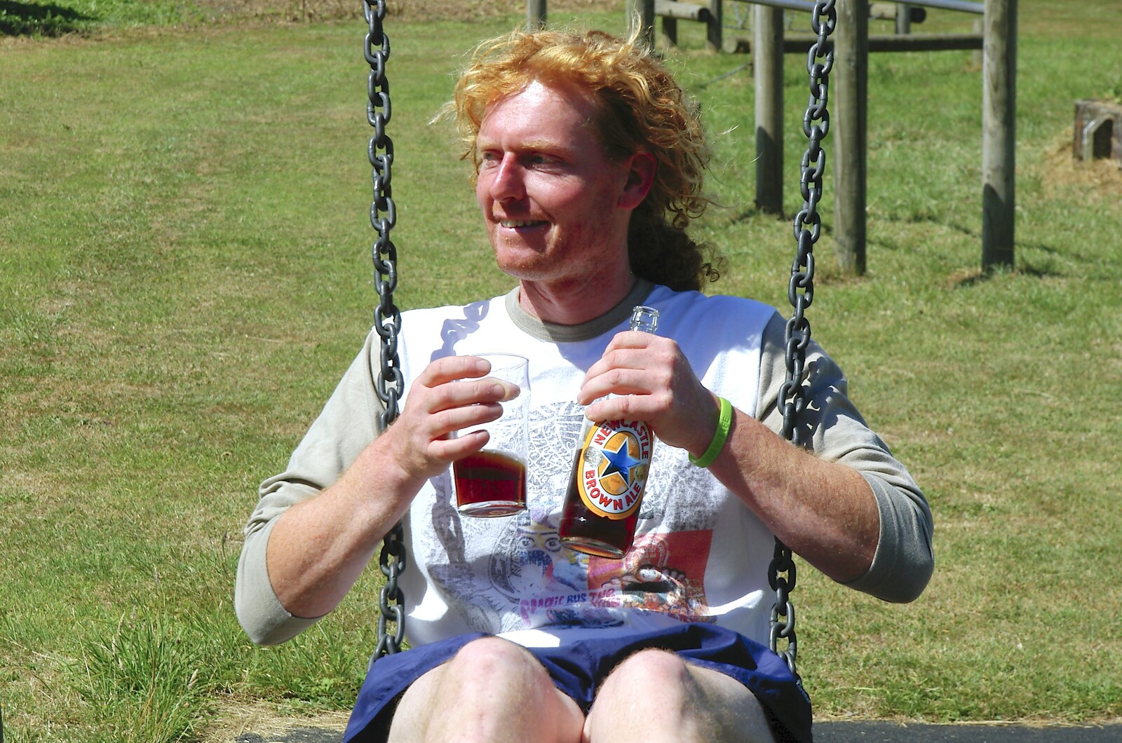 Wavy swings around with a Newcastle Brown from The BSCC Charity Bike Ride, Orford, Suffolk - 15th July 2006
