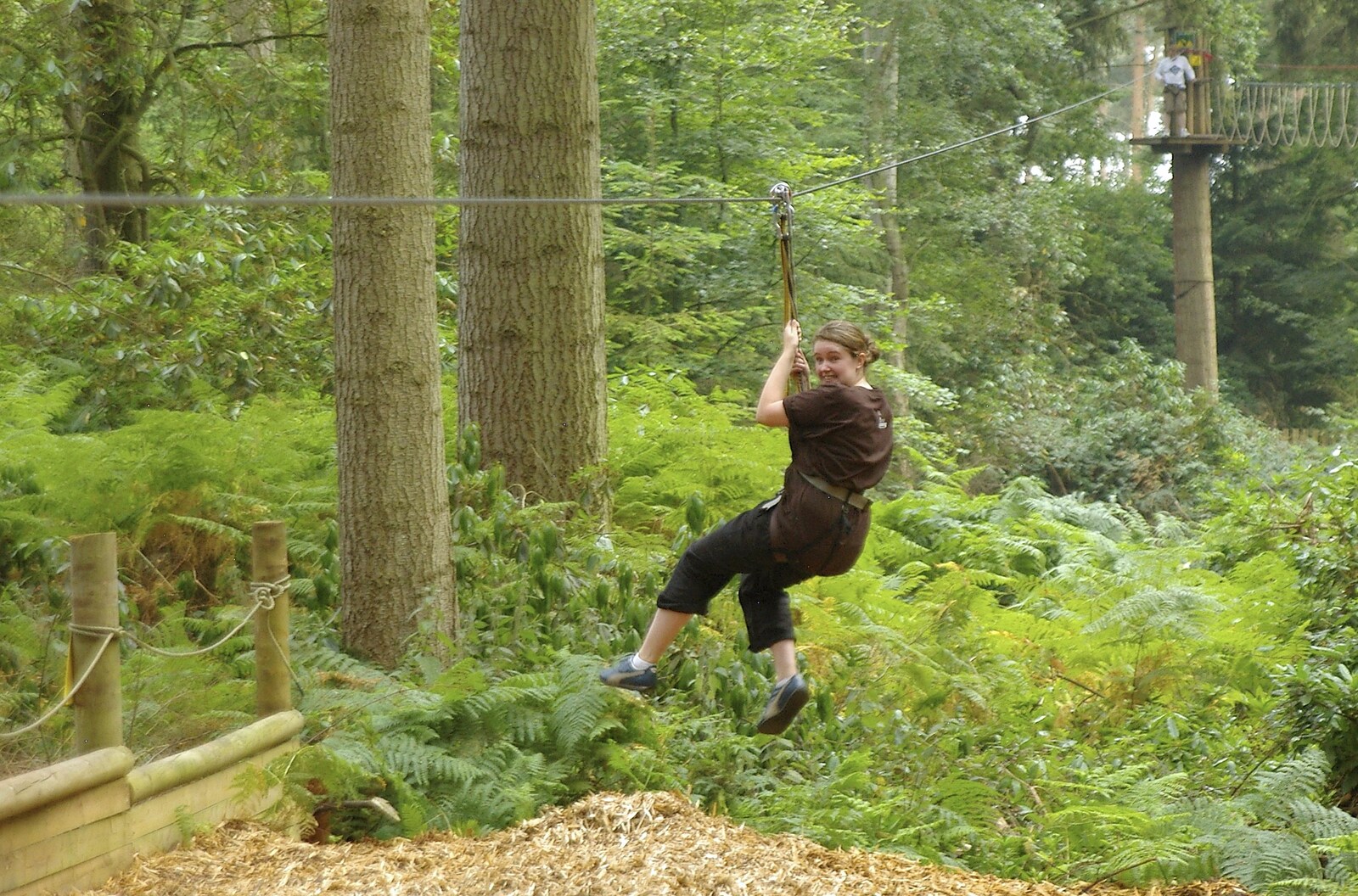 Isobel comes in to land from Qualcomm Cambridge "Go Ape", High Lodge, Thetford Forest - 27th July 2006
