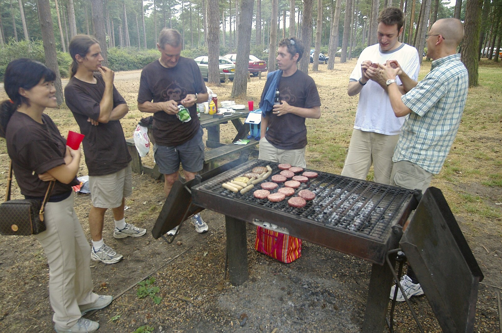 Barbequed burgers from Qualcomm Cambridge "Go Ape", High Lodge, Thetford Forest - 27th July 2006
