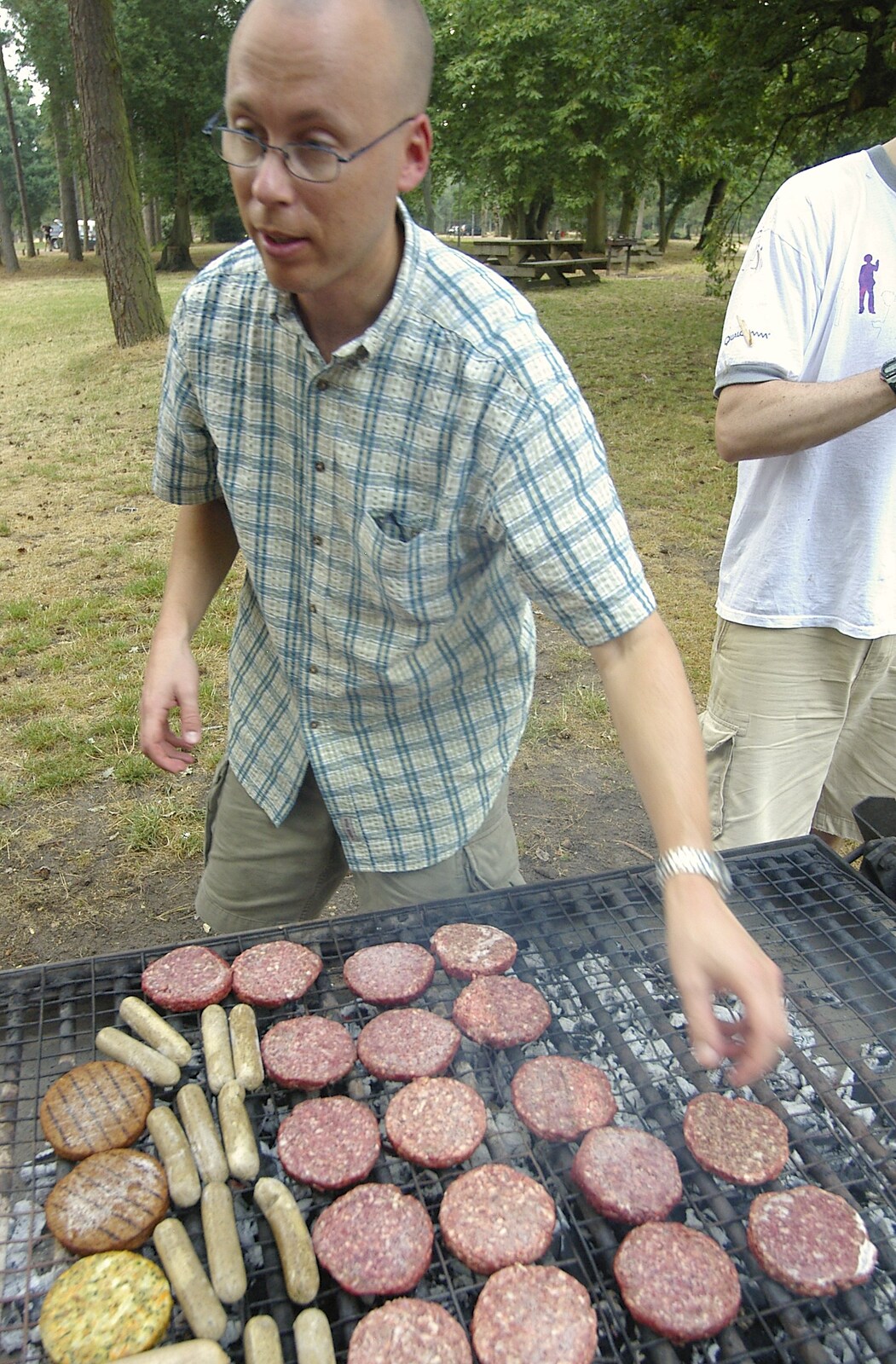 Marc Nijdam manage the burgers from Qualcomm Cambridge "Go Ape", High Lodge, Thetford Forest - 27th July 2006