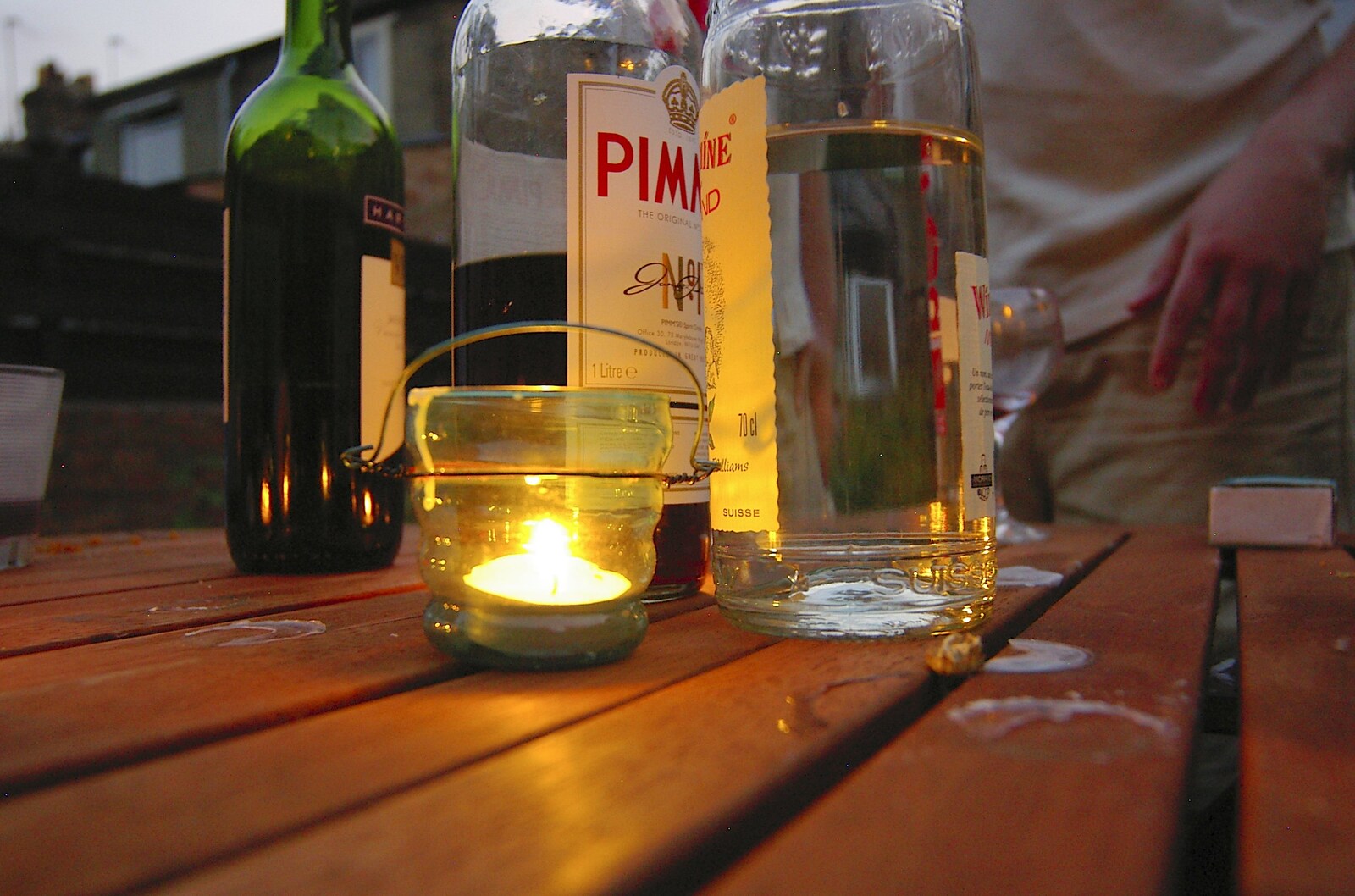 A tea-light illuminates a bottle of Pimms from A Kingston Street Barbeque with Rachel and Sam, North Romsey, Cambridge- 2nd August 2006