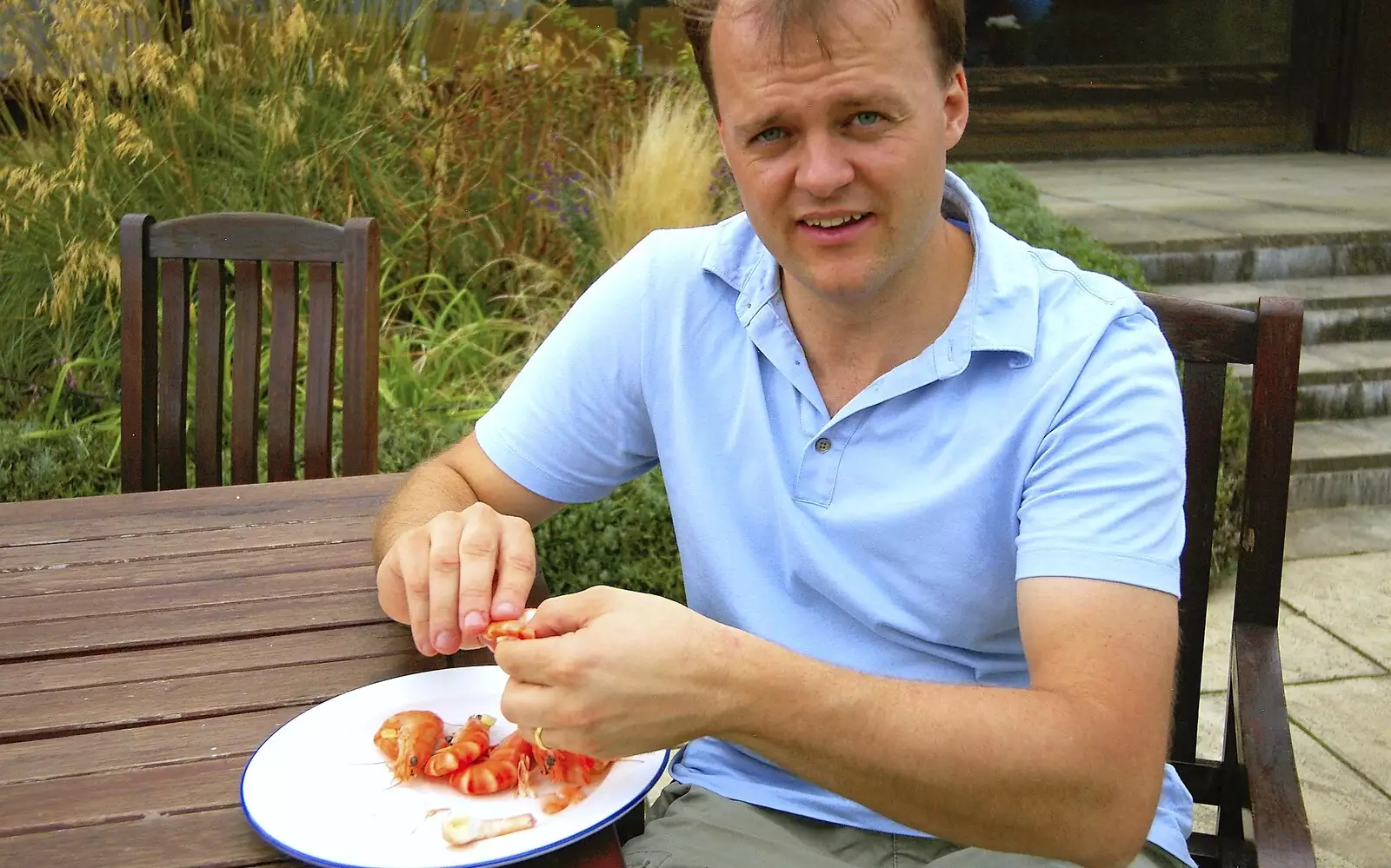 Nick munches his way through a heap of prawns, from Qualcomm's Summer Circus Thrash, Churchill College, Cambridge - 18th August 2006