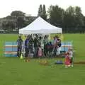 Sheltering from the rain, Qualcomm's Summer Circus Thrash, Churchill College, Cambridge - 18th August 2006