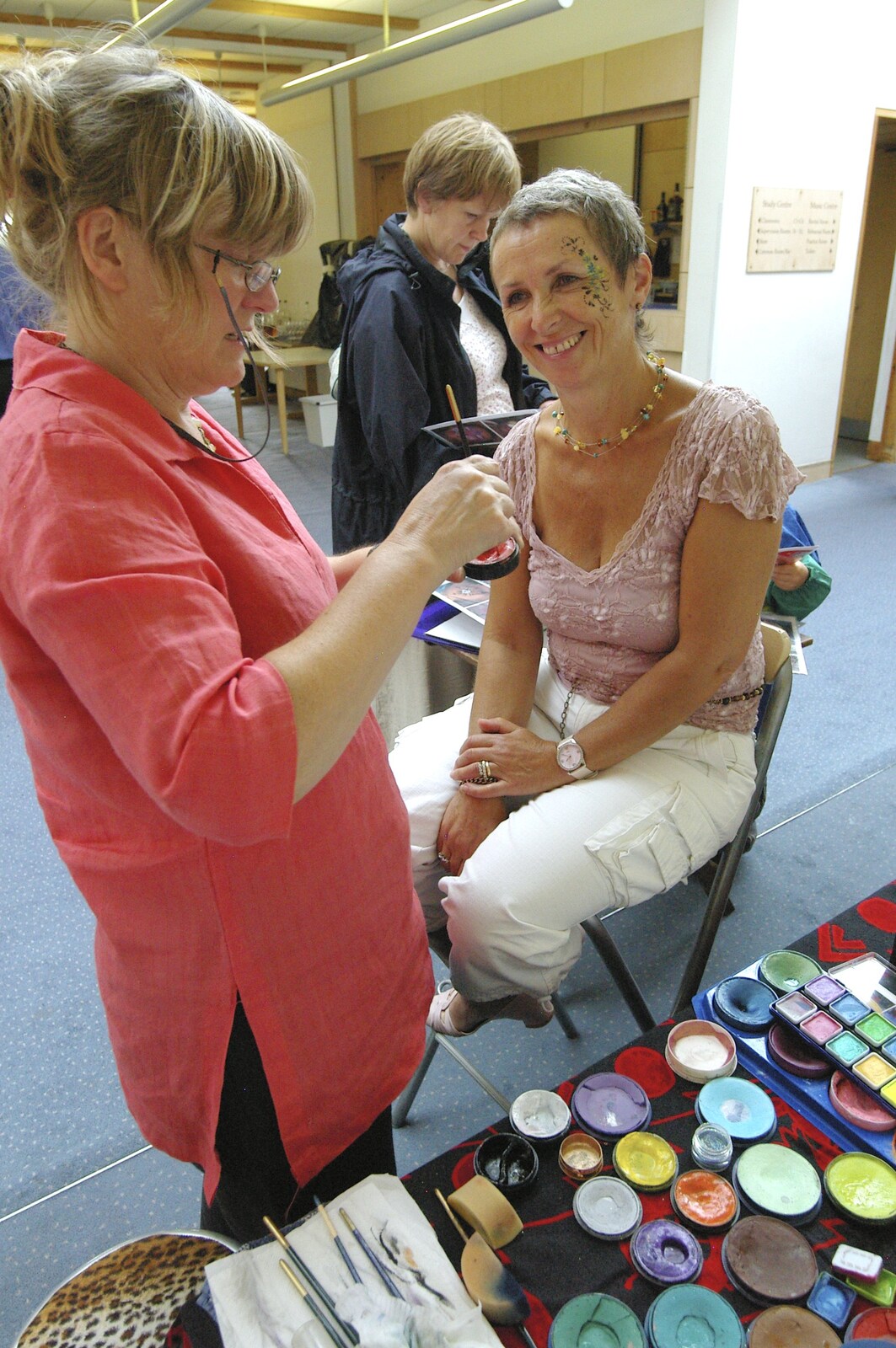 Mrs Tim has a go at face painting from Qualcomm's Summer Circus Thrash, Churchill College, Cambridge - 18th August 2006