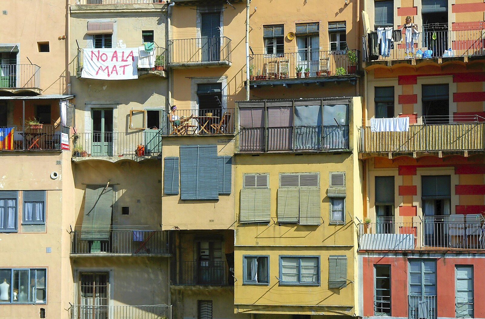 A protest banner flutters in the warm breeze from Girona, Catalunya, Spain - 17th September 2006