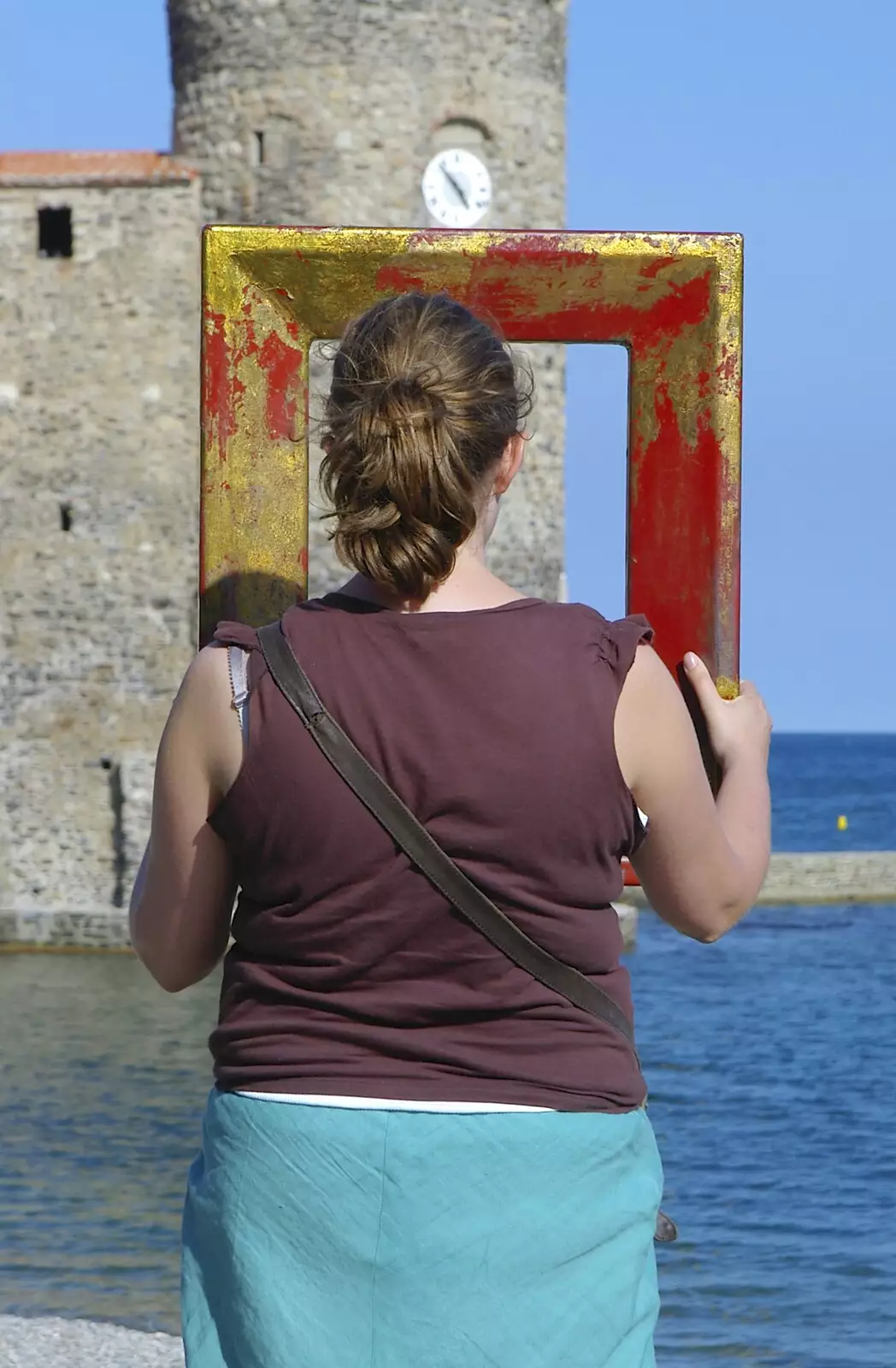 Isobel has a peer through a picture frame, from The Colourful Boats of Collioure, France - 20th September 2006