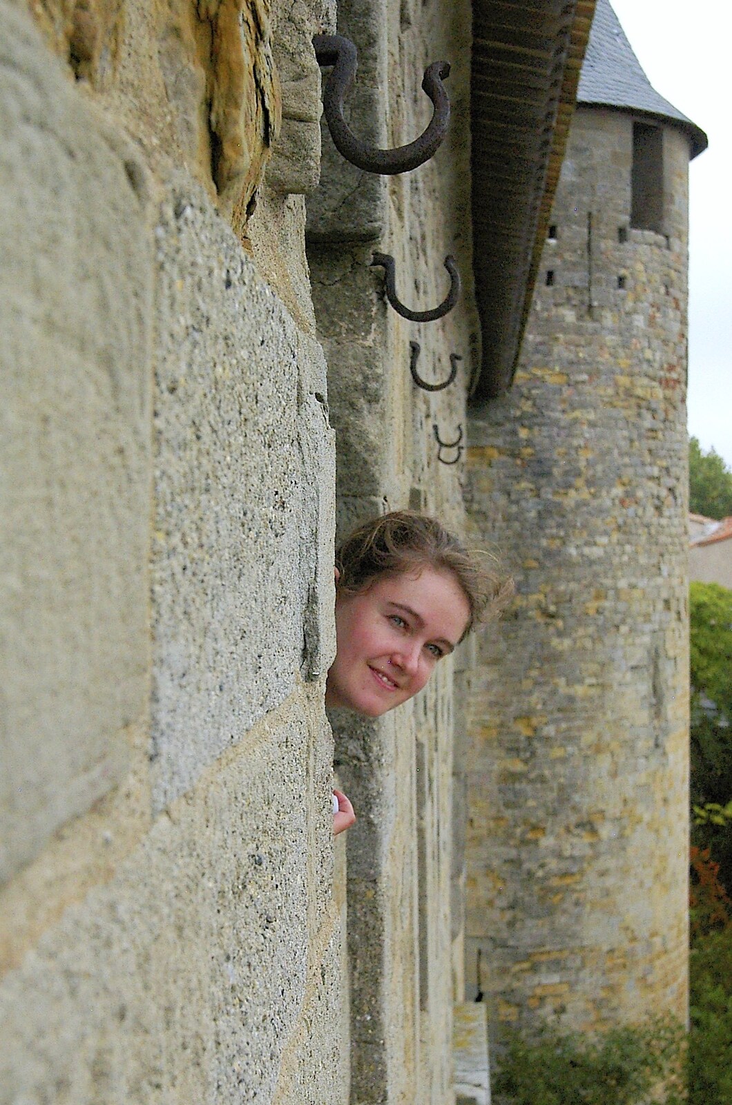 Isobel peeps out of a window at Château Comtal from A Couple of Days in Carcassonne, Aude, France - 21st September 2006