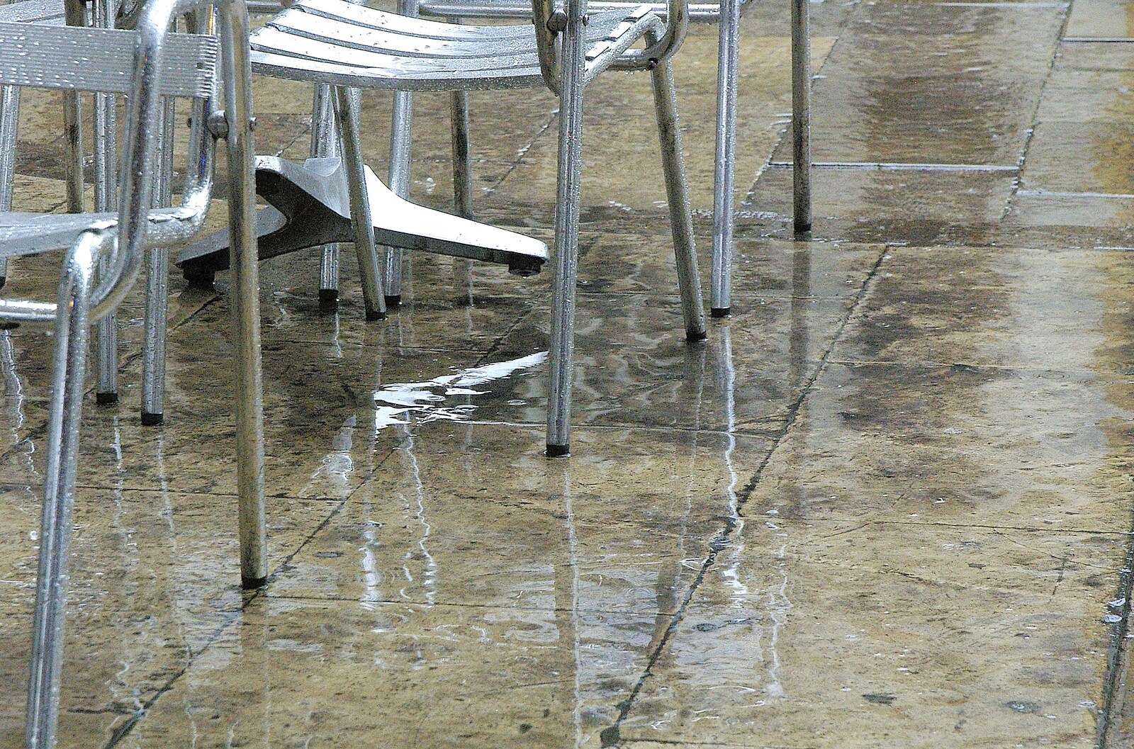 Wet flagstones and the reflection of chairs from Two Days in Barcelona, Catalunya, Spain - 22nd September 2006