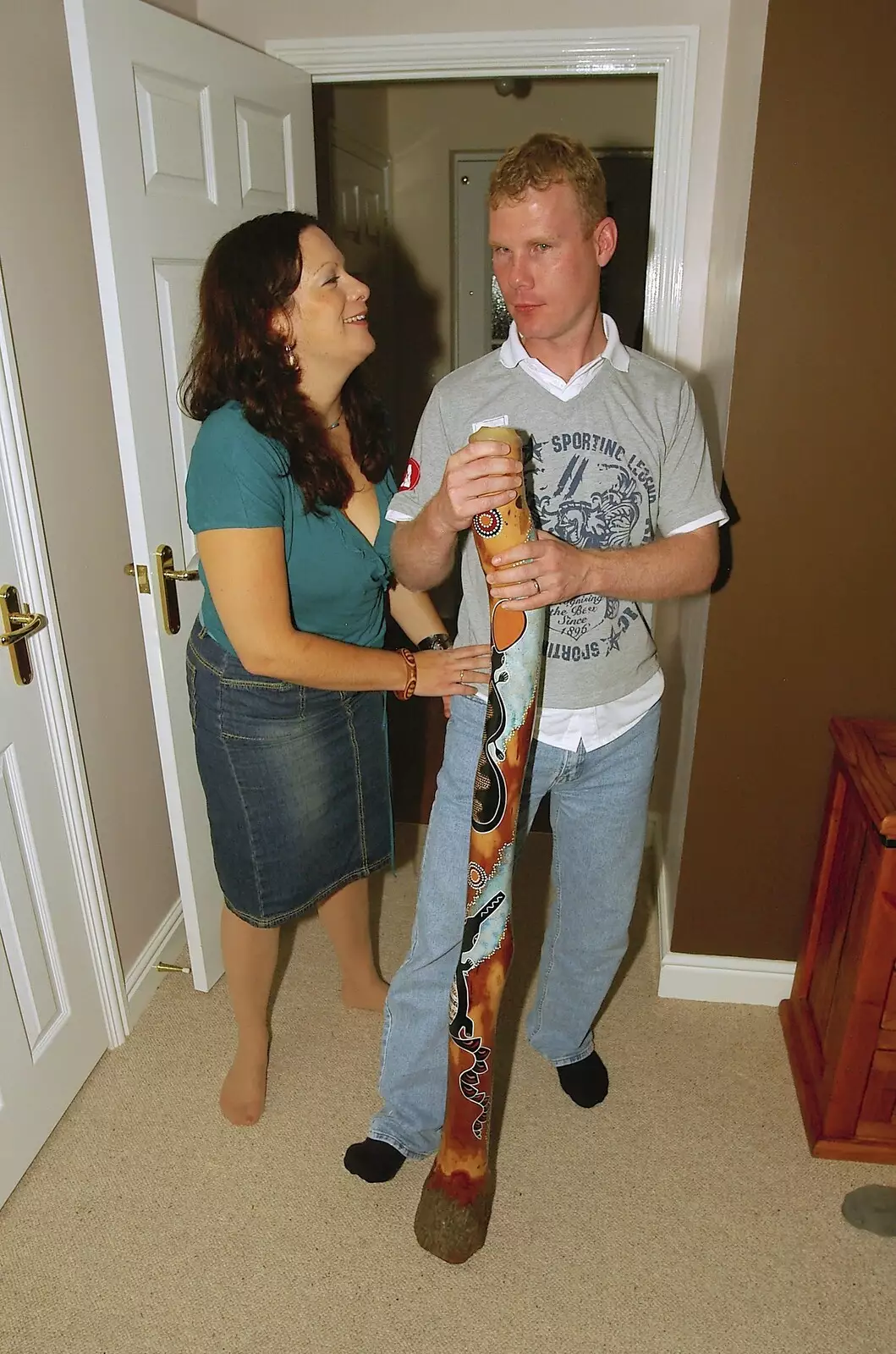 Clare and Mikey-P try didgeridoo, from Fondue, Housewarmings and The Sock (An Epilogue), Cambridge and Diss - 29th September 2006