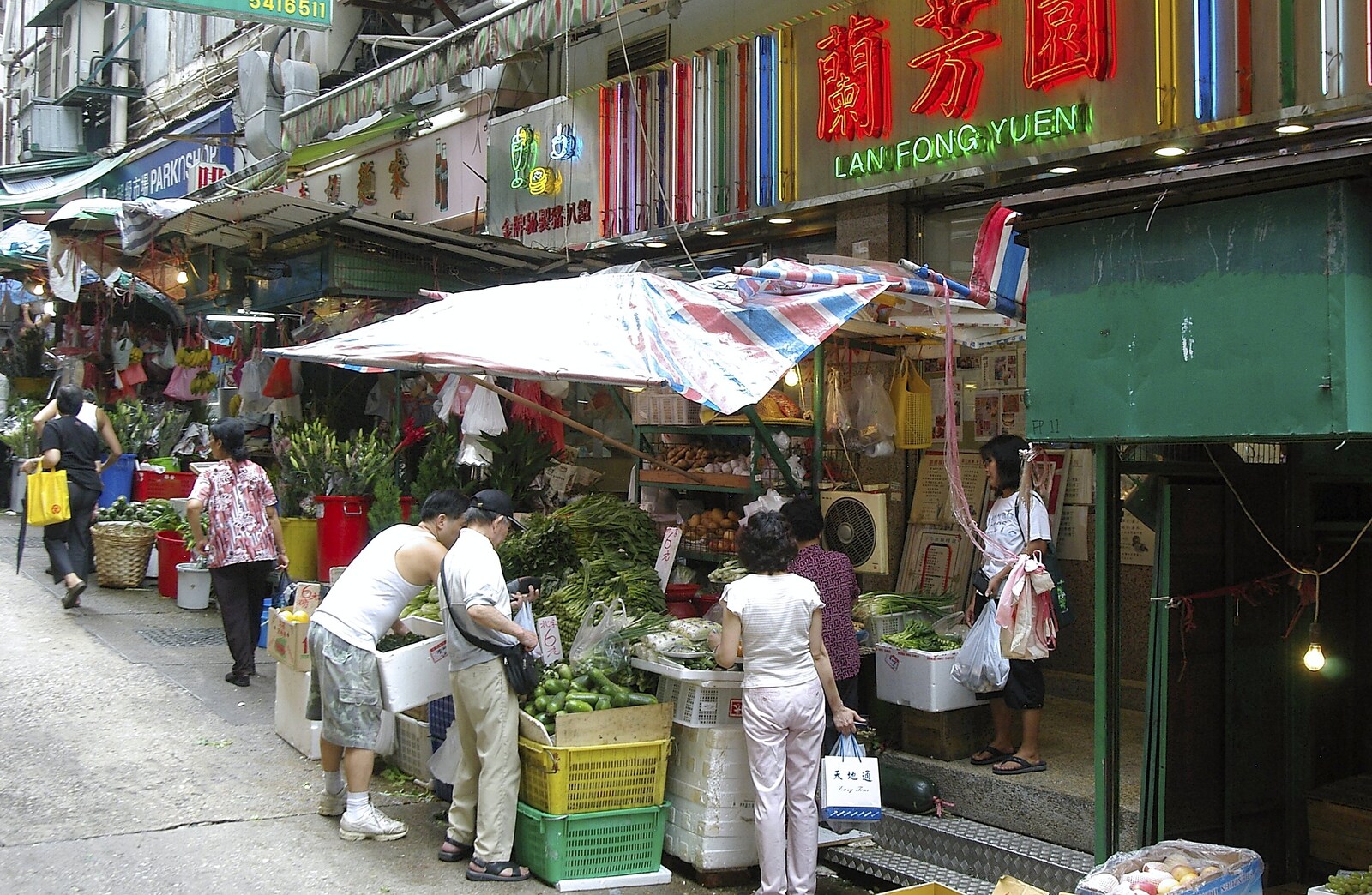 Neon lights and vegetable stalls from Lan Kwai Fong Market, Hong Kong, China - 4th October 2006