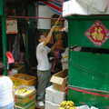 An ad-hoc awning is lifted into place, Lan Kwai Fong Market, Hong Kong, China - 4th October 2006