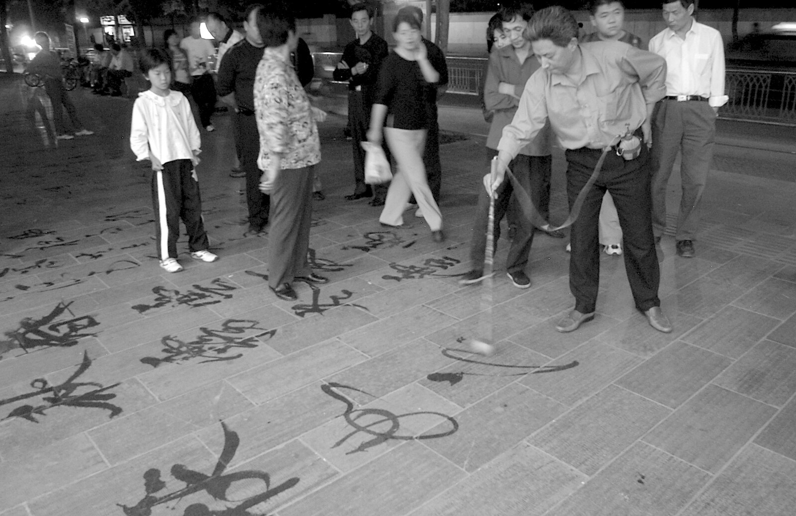 A dude writes with water on the slate pavement from Nanjing by Night, Nanjing, Jiangsu Province, China - 4th October 2006