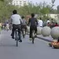 A woman tries to sell fruit as cyclists pass by, A Few Days in Nanjing, Jiangsu Province, China - 7th October 2006