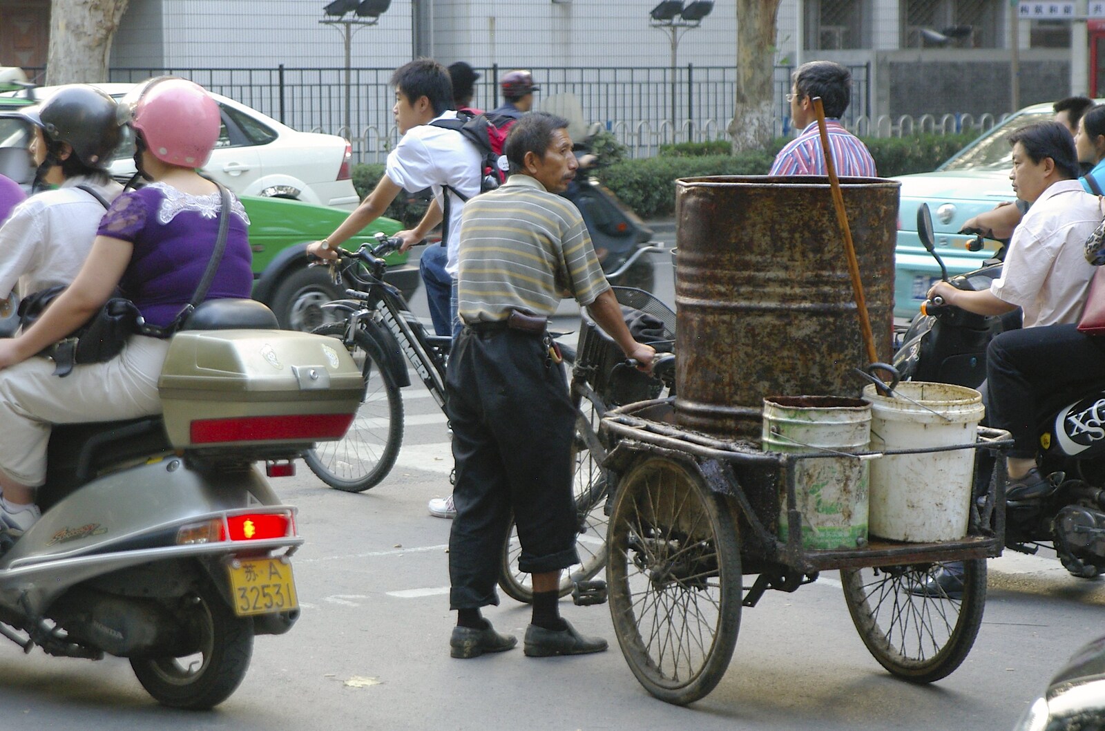 A guy pauses whilst hauling tubs of mystery stuff from A Few Days in Nanjing, Jiangsu Province, China - 7th October 2006