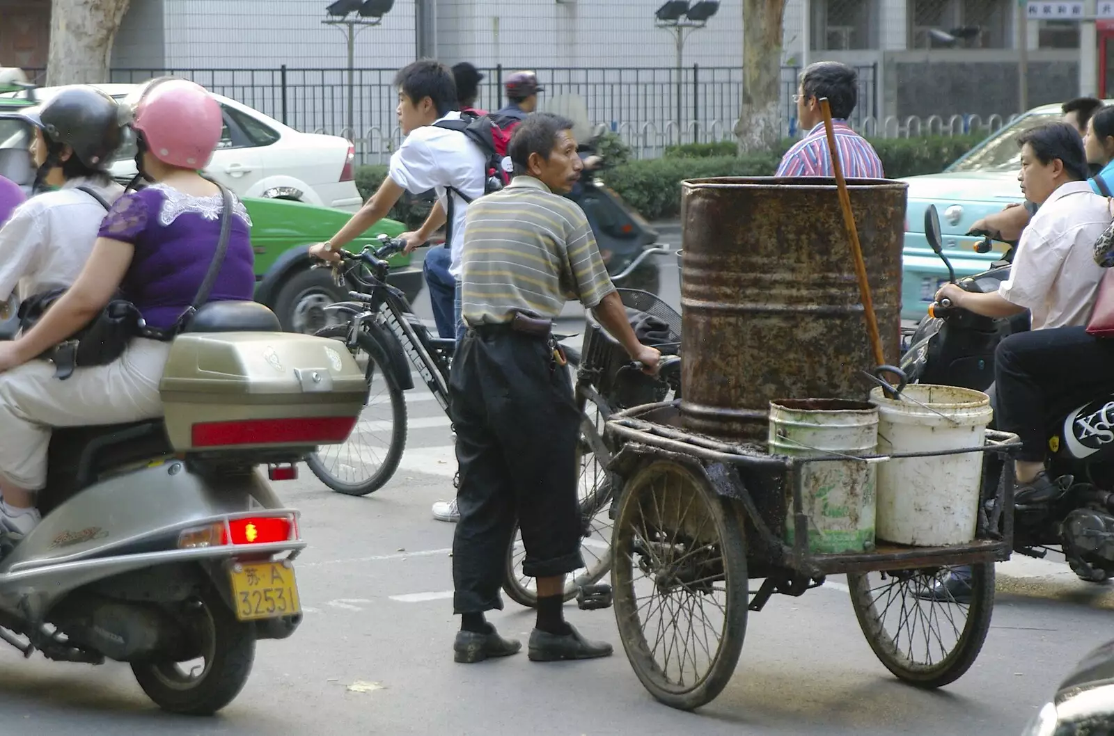 A guy pauses whilst hauling tubs of mystery stuff, from A Few Days in Nanjing, Jiangsu Province, China - 7th October 2006