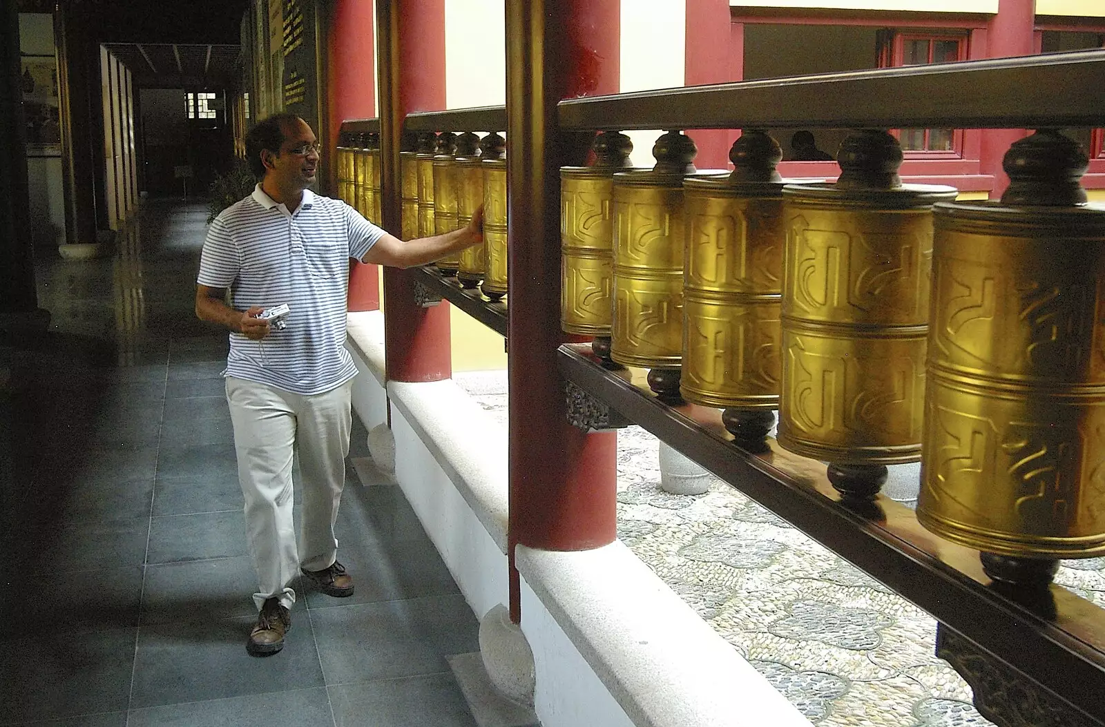 Colleague Ashish spins the Buddhist prayer wheels, from A Few Days in Nanjing, Jiangsu Province, China - 7th October 2006