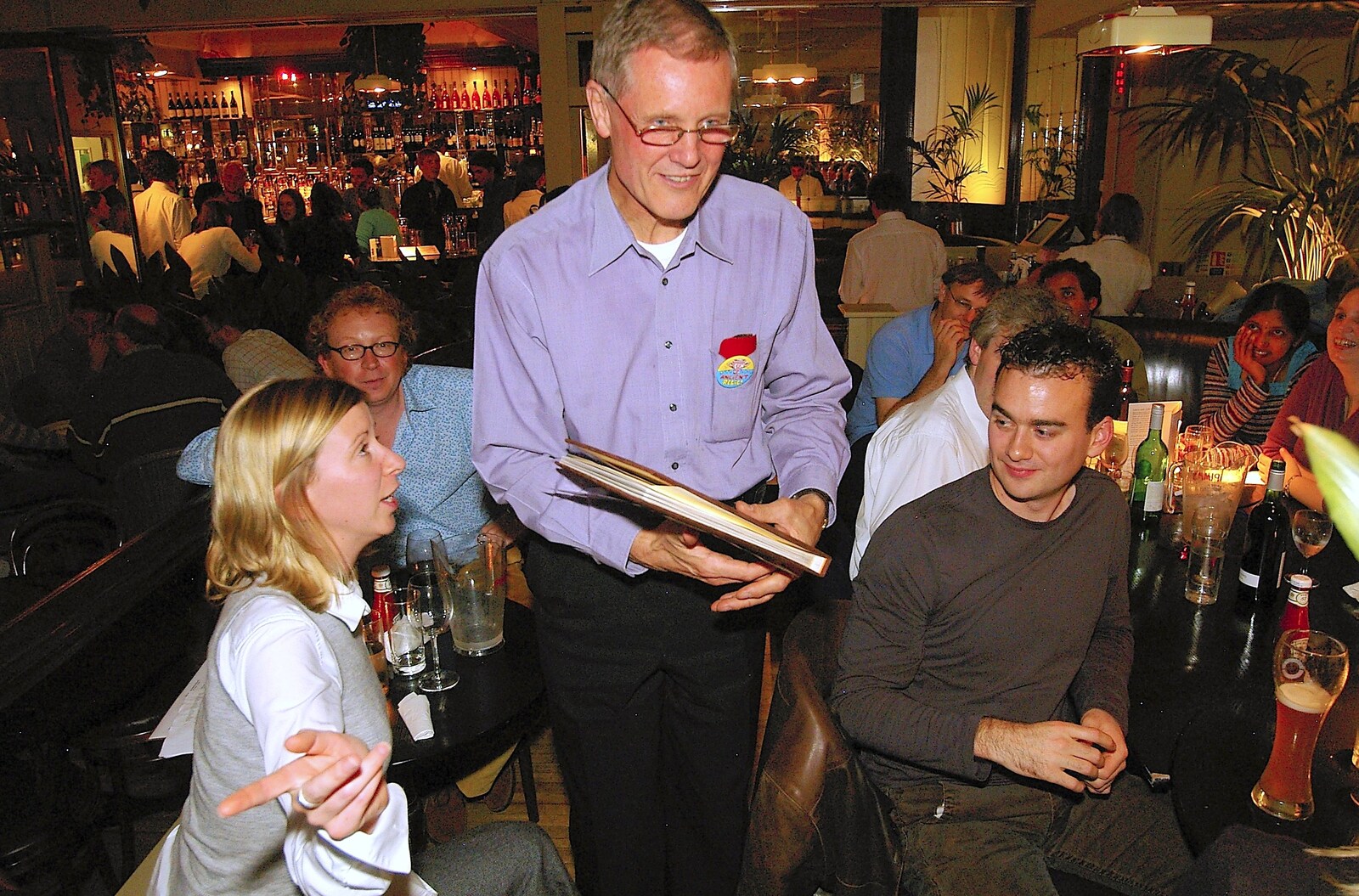 Tim has some sort of book from Tim's 60th Birthday, Brown's Restaurant, Trumpington Road, Cambridge - 16th October 2006