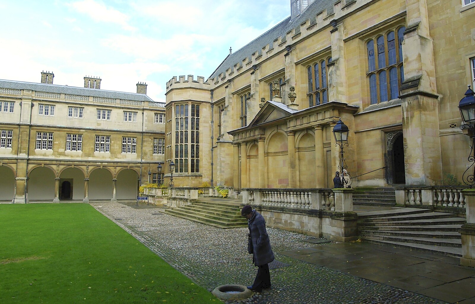 Isobel peers at a pool of water from Autumn Colleges: a Wander around The Backs, Cambridge - 26th November