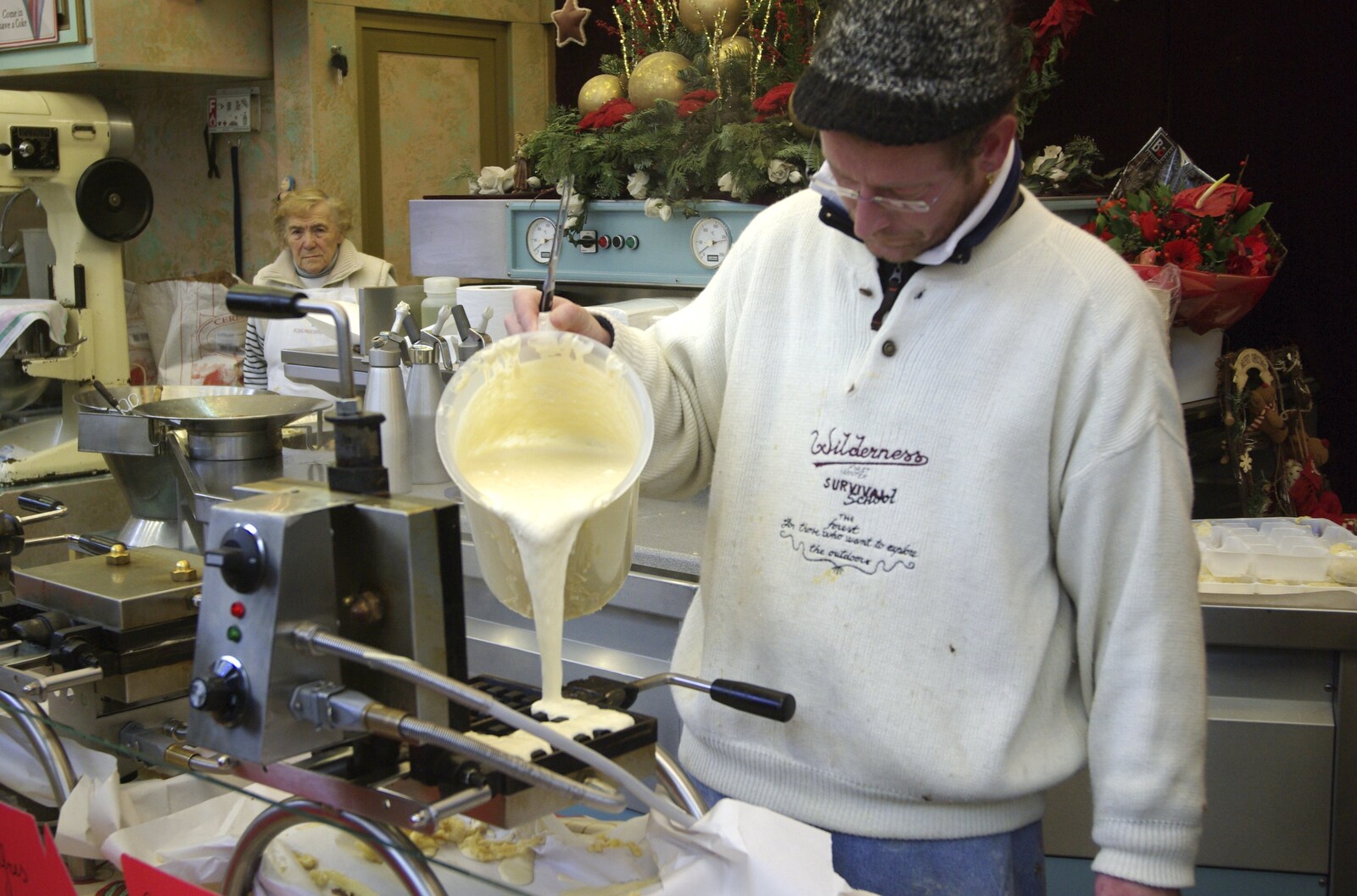 Waffle batter is poured into a waffle iron from The Christmas Markets of Brussels, Belgium - 1st January 2007