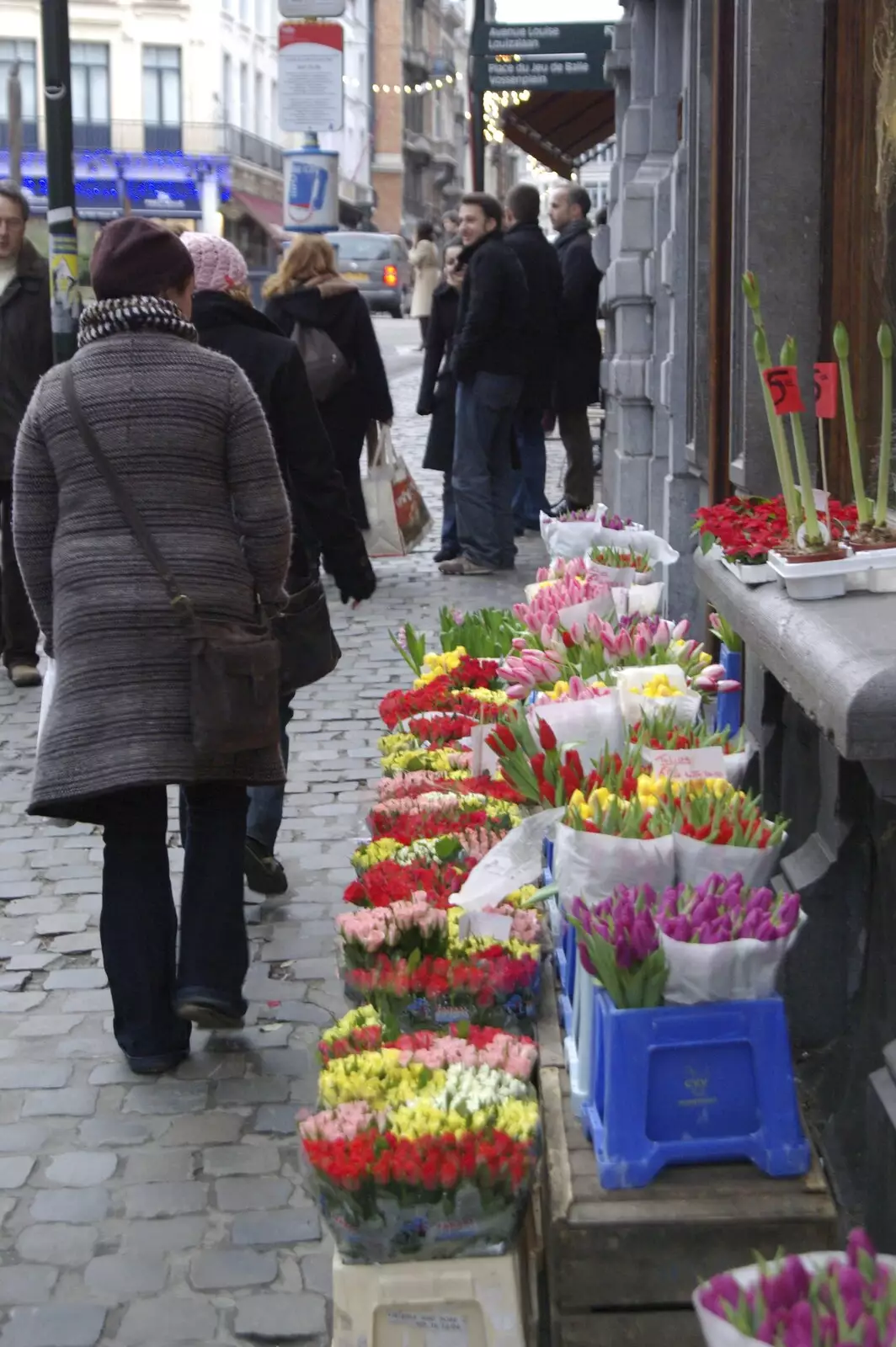 Isobel passes a flower shop, from The Christmas Markets of Brussels, Belgium - 1st January 2007