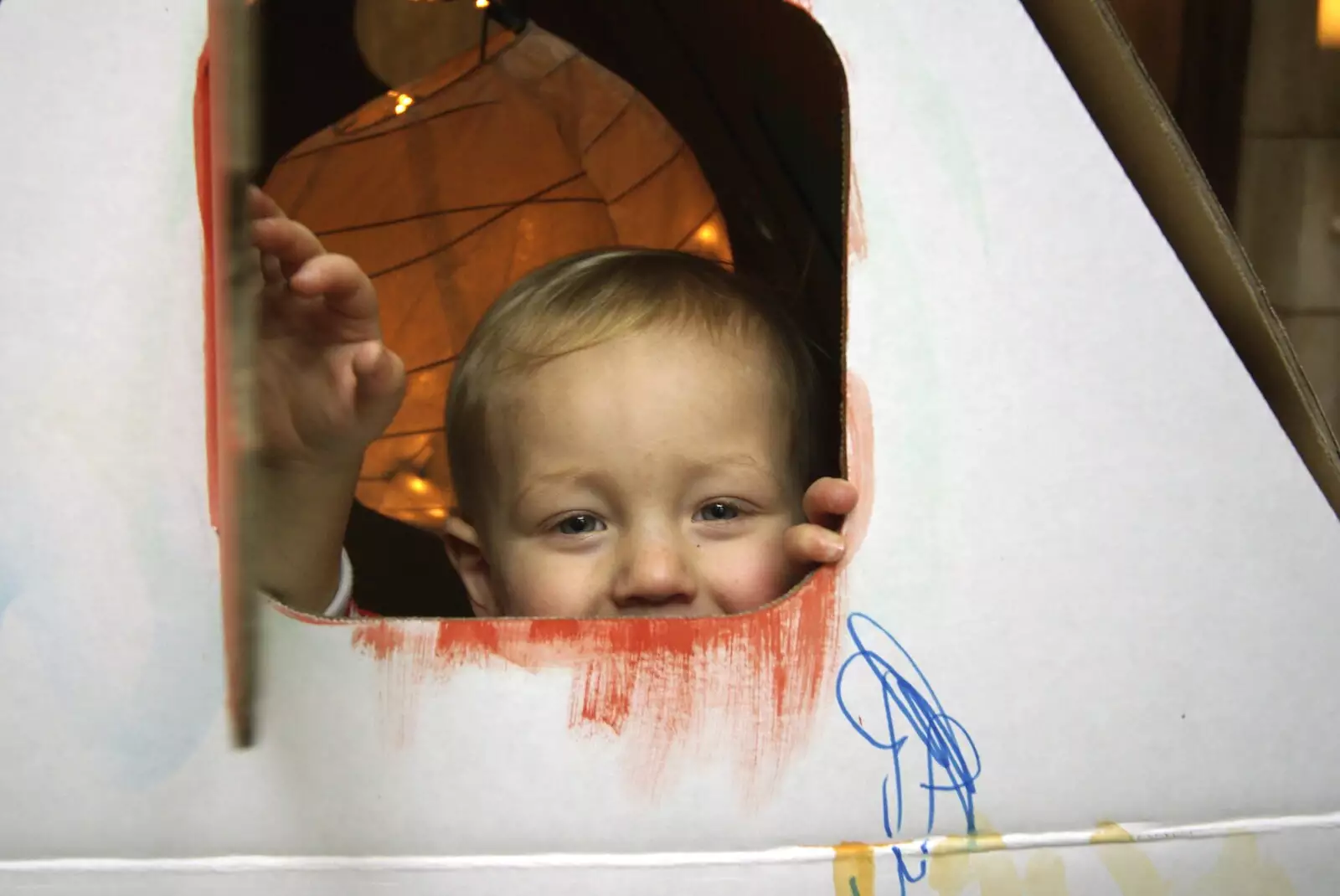 Kai peers out of the cardboard Wendy House, from The Christmas Markets of Brussels, Belgium - 1st January 2007