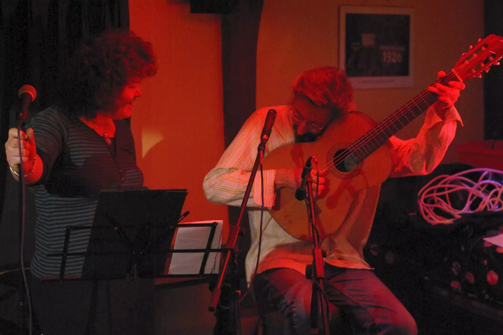 Rob re-tunes his guitar, from Rob and Jo Play the Crown, Burston, Norfolk - 18th February 2007