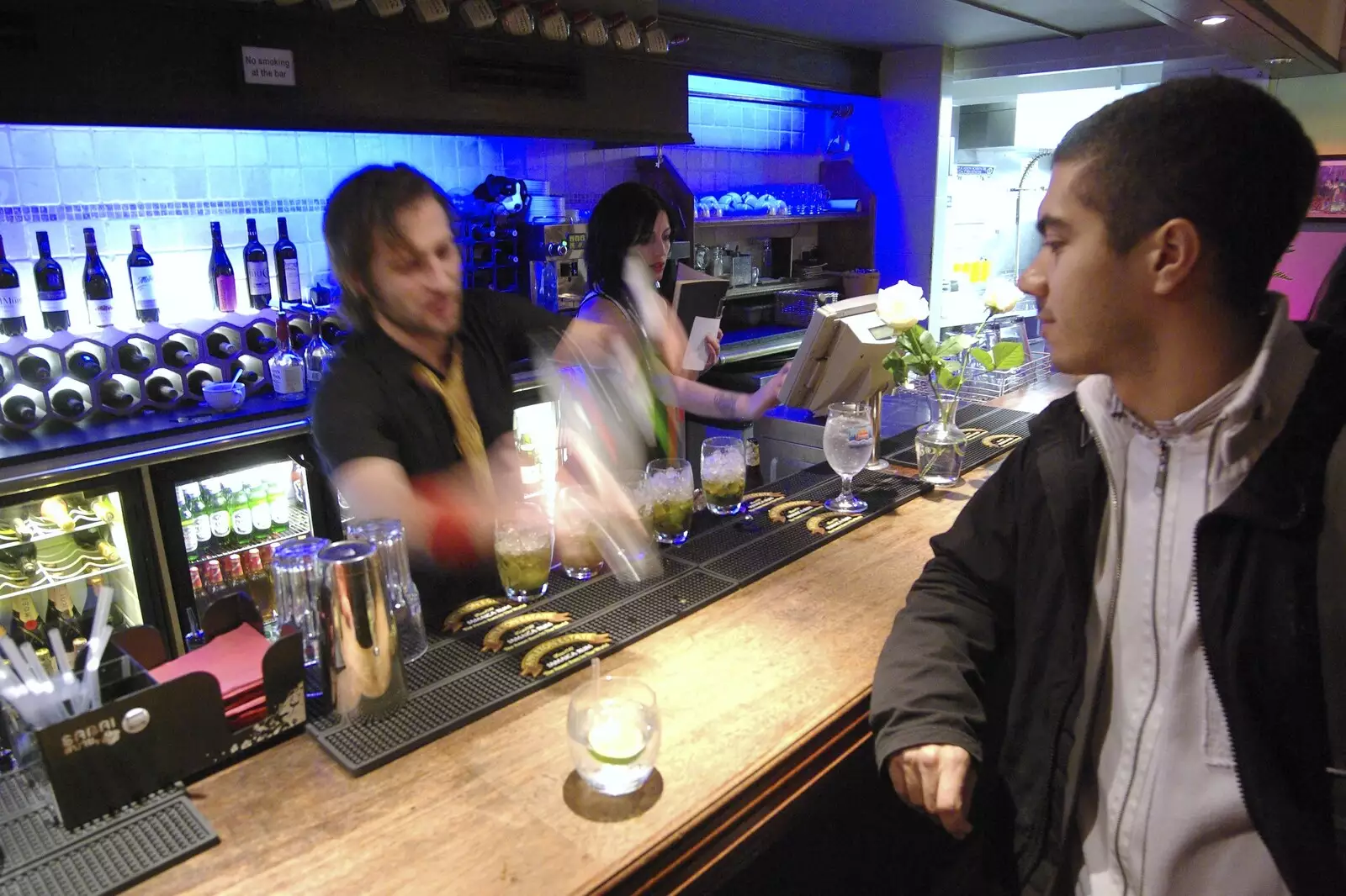 The barman is a blur as Marc waits for the drinks, from Taptu on the Razz at La Raza, Rose Crescent, Cambridge - 22nd February 2007