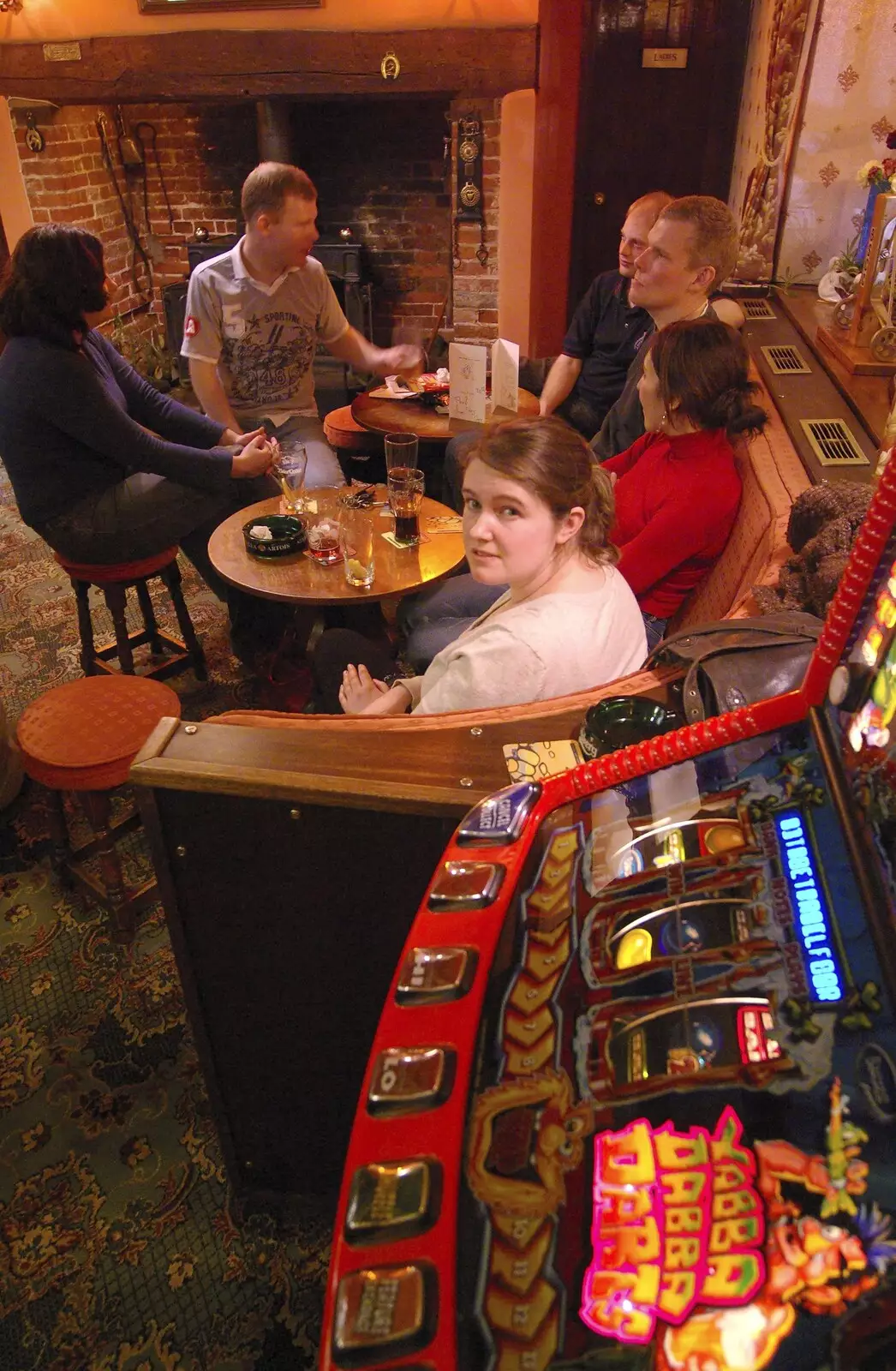 Isobel looks over the fruit machine, from Paul's 30th in the Swan Inn, Brome, Suffolk - 3rd March 2007