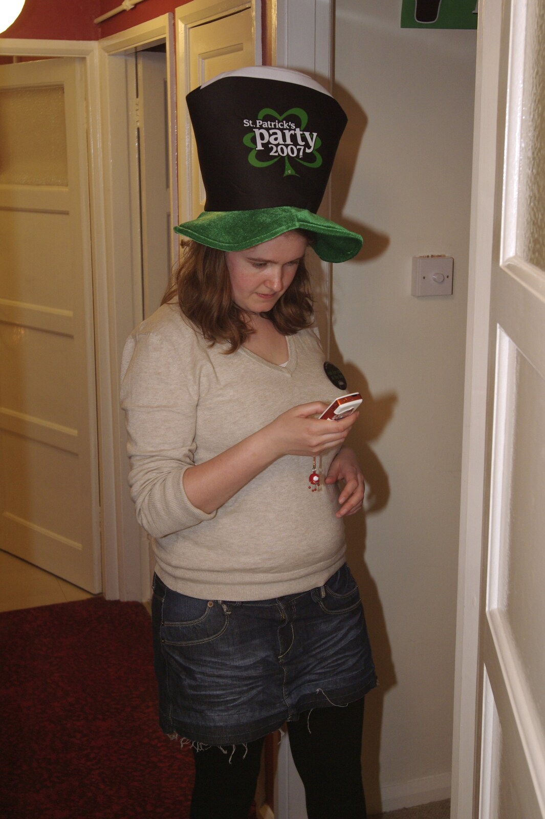 Isobel's House Warming, a Gospel Hall, and Derelict Newsagents, Ward Road, Cambridge - 17th March 2007: Isobel with novelty hat sends a text