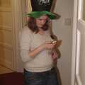 Isobel with novelty hat sends a text, Isobel's House Warming, a Gospel Hall, and Derelict Newsagents, Ward Road, Cambridge - 17th March 2007